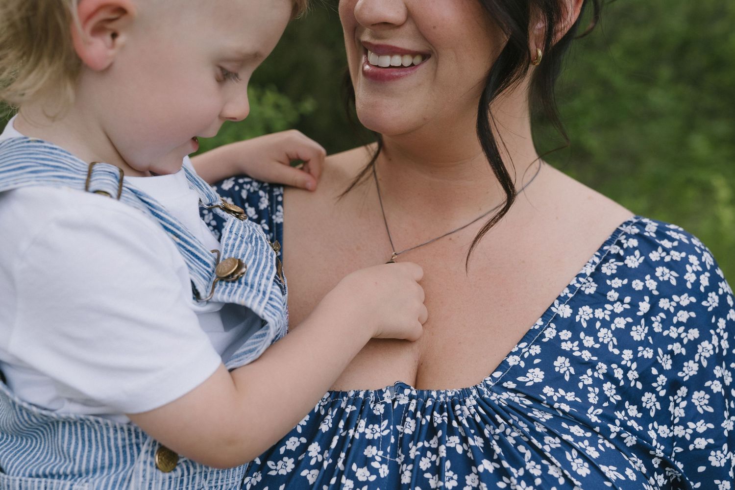 Signature motherhood portraits in Regina, Saskatchewan capturing authentic connection between mothers and their children.