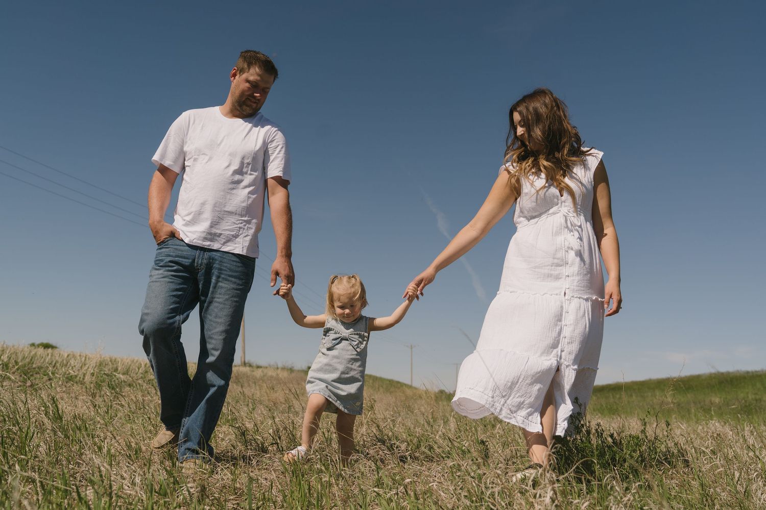 Family portraits in Regina, Saskatchewan capturing authentic connection between parents and their children.