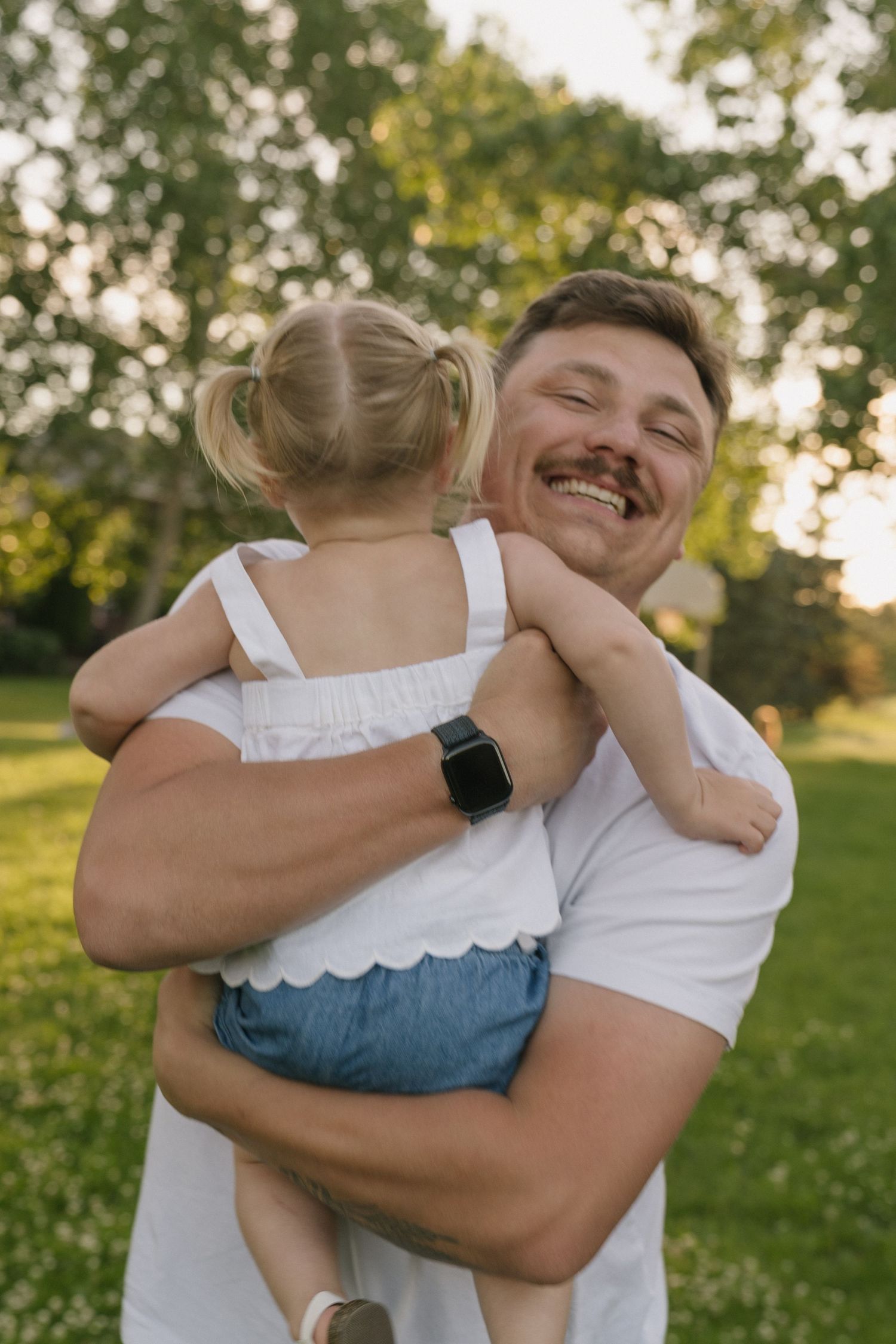 Family portraits in Regina, Saskatchewan capturing authentic connection between parents and their children.
