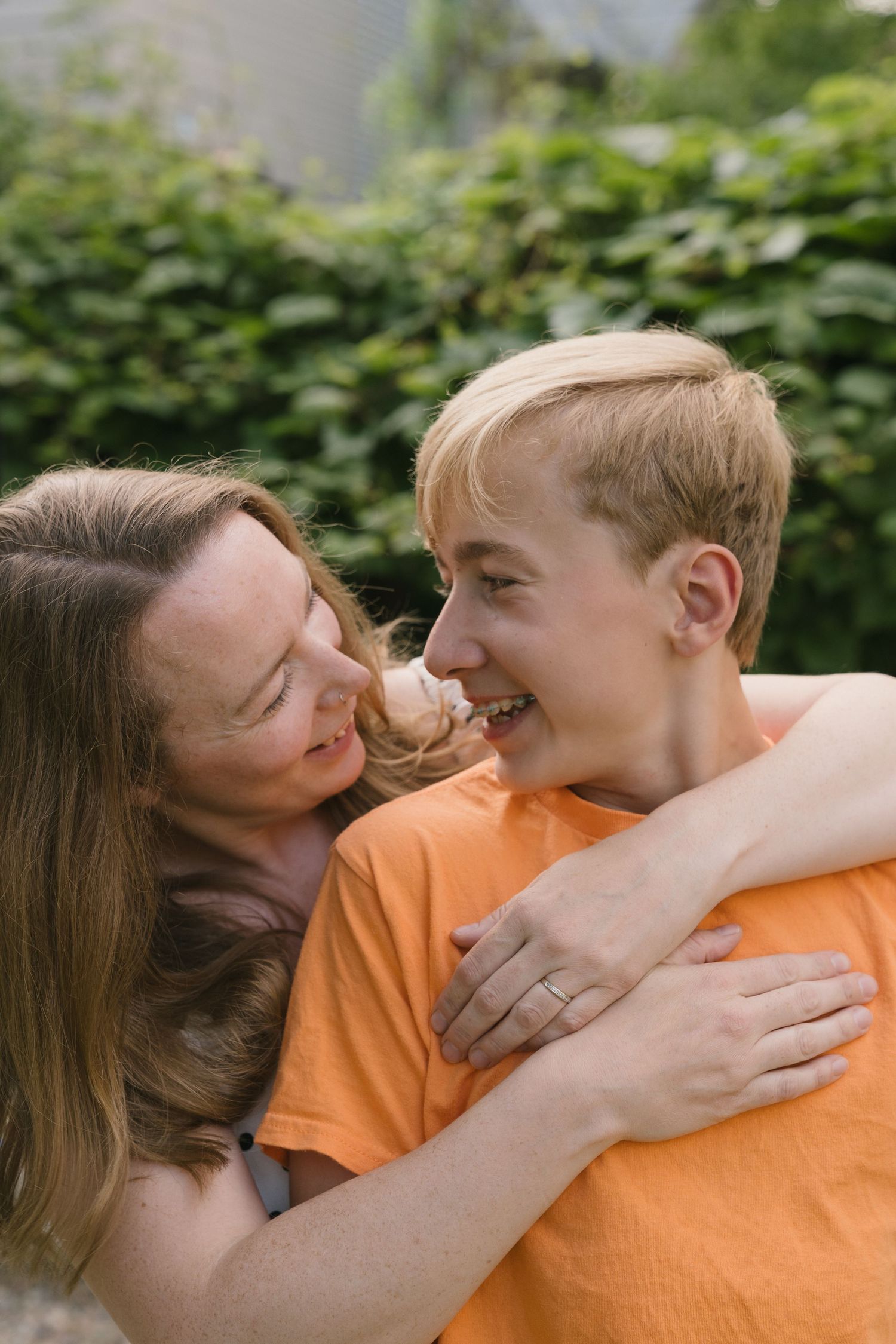 Signature motherhood portraits in Regina, Saskatchewan capturing authentic connection between mothers and their children.