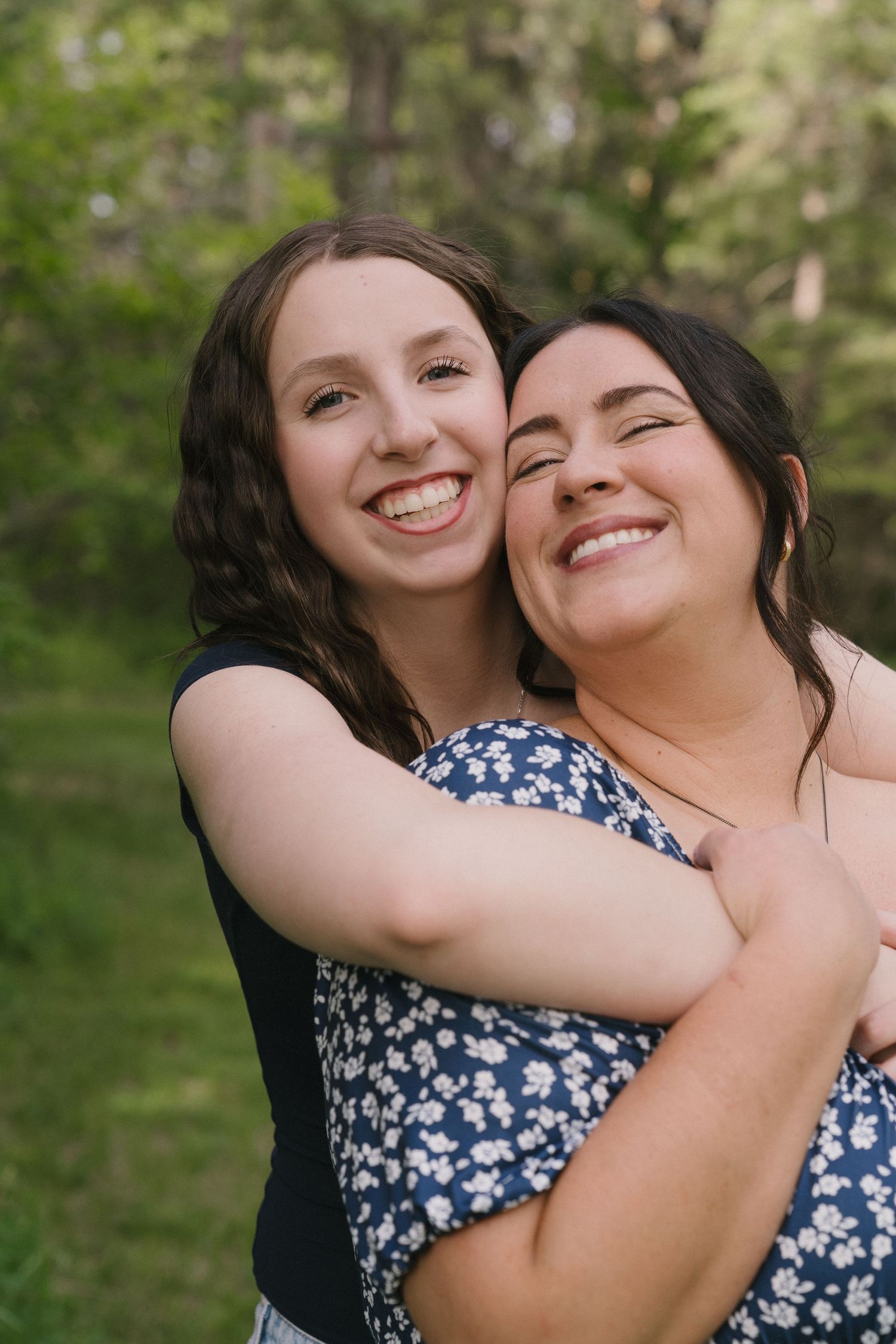 Signature motherhood portraits in Regina, Saskatchewan capturing authentic connection between mothers and their children.