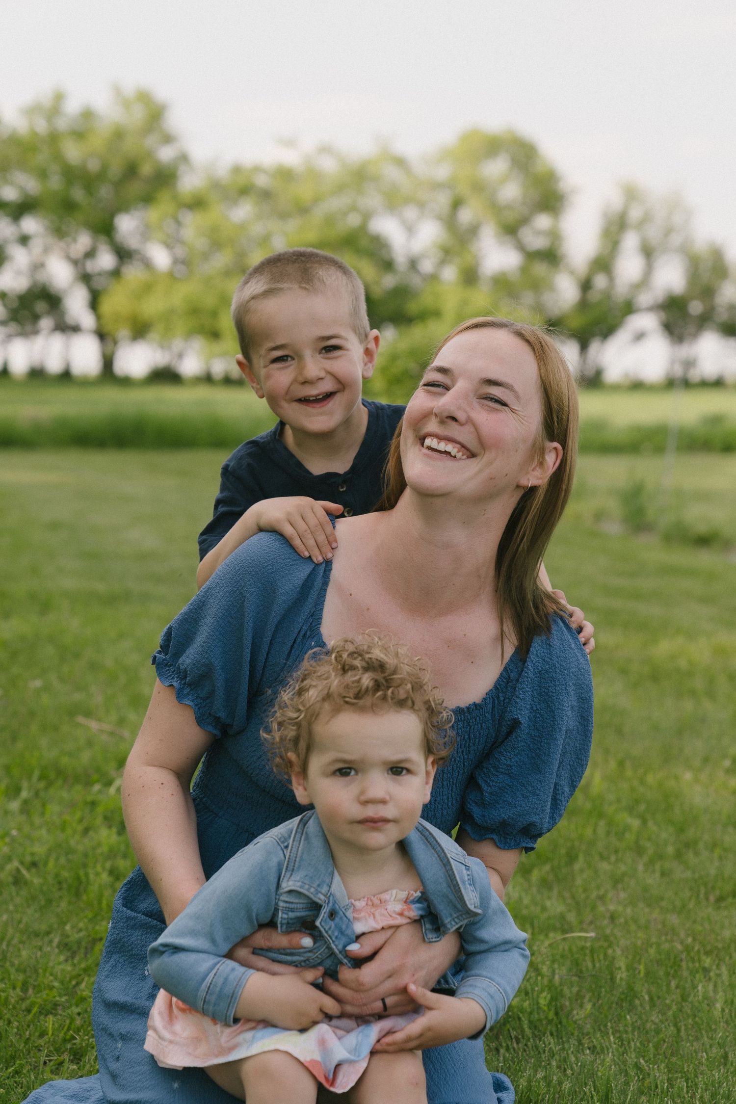 Signature motherhood portraits in Regina, Saskatchewan capturing authentic connection between mothers and their children.