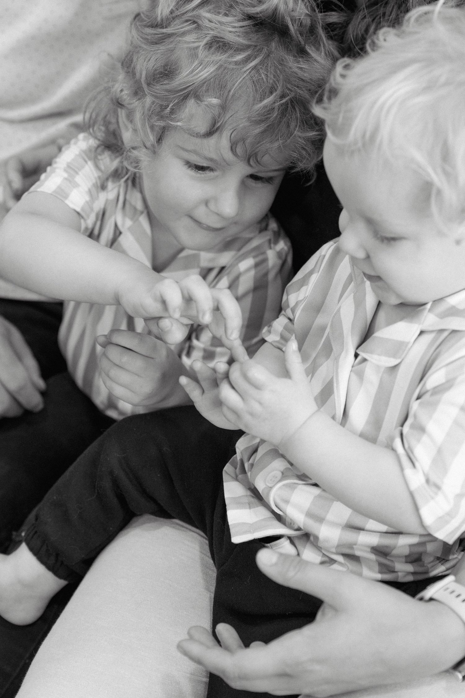 Family portraits in Regina, Saskatchewan capturing authentic connection between parents and their children.