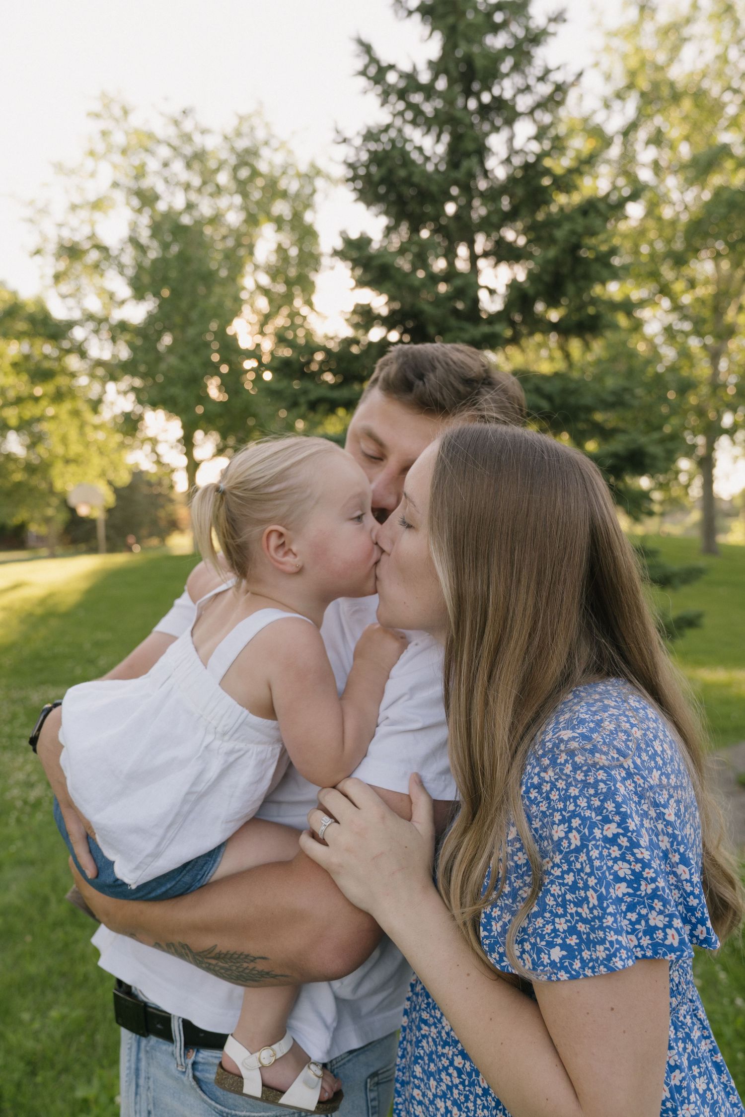 Family portraits in Regina, Saskatchewan capturing authentic connection between parents and their children.