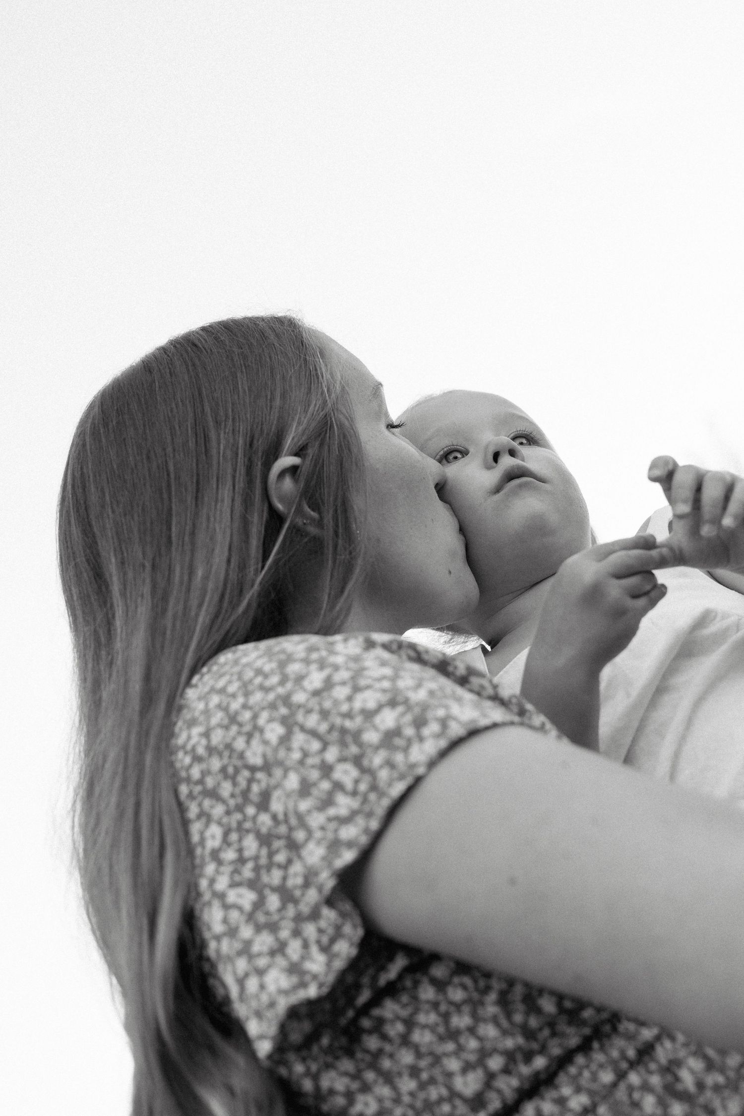 Motherhood portraits in Regina, Saskatchewan capturing authentic connection between mothers and their children.