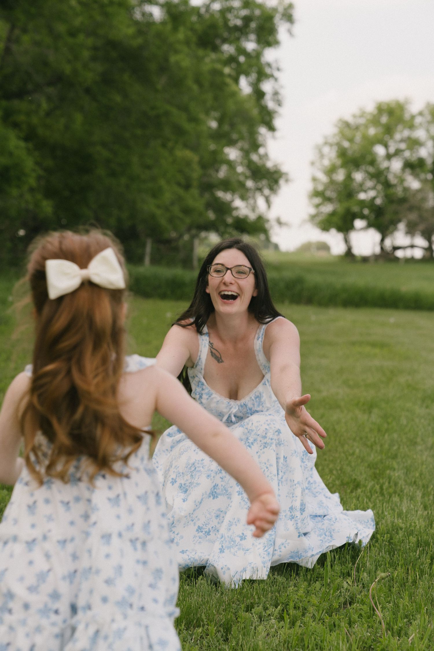 Signature motherhood portraits in Regina, Saskatchewan capturing authentic connection between mothers and their children.
