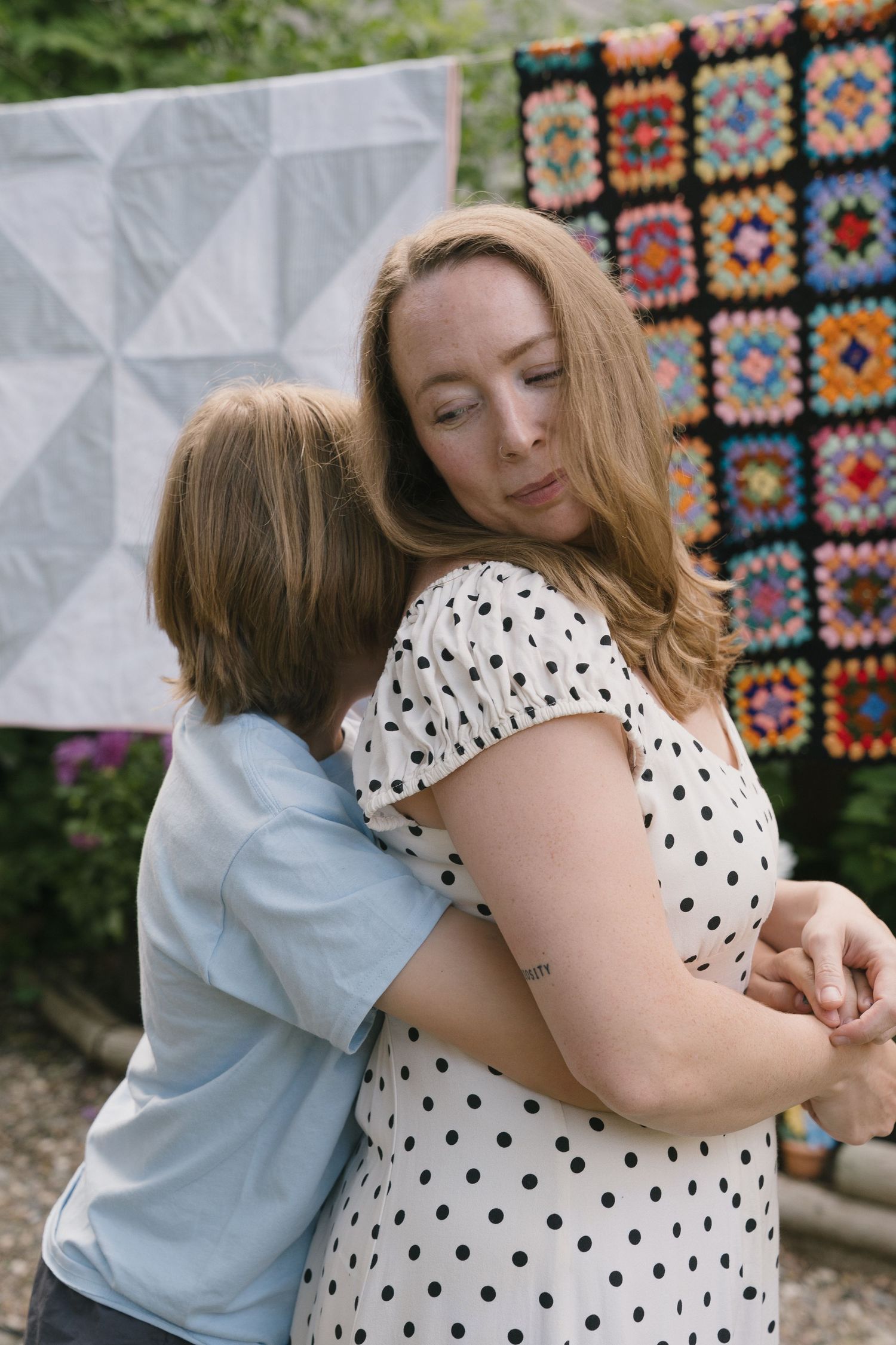 Signature motherhood portraits in Regina, Saskatchewan capturing authentic connection between mothers and their children.