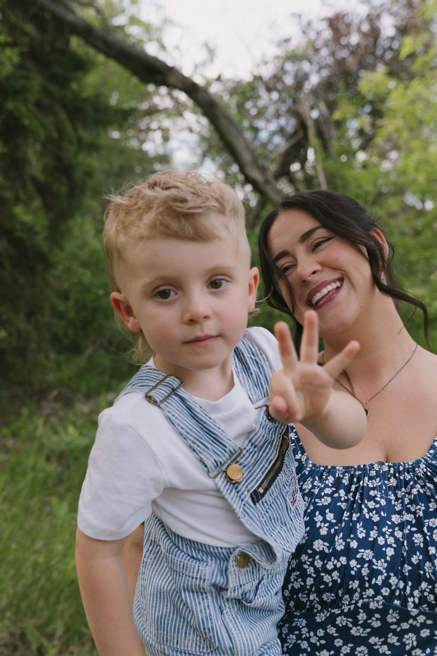 Signature motherhood portraits in Regina, Saskatchewan capturing authentic connection between mothers and their children.