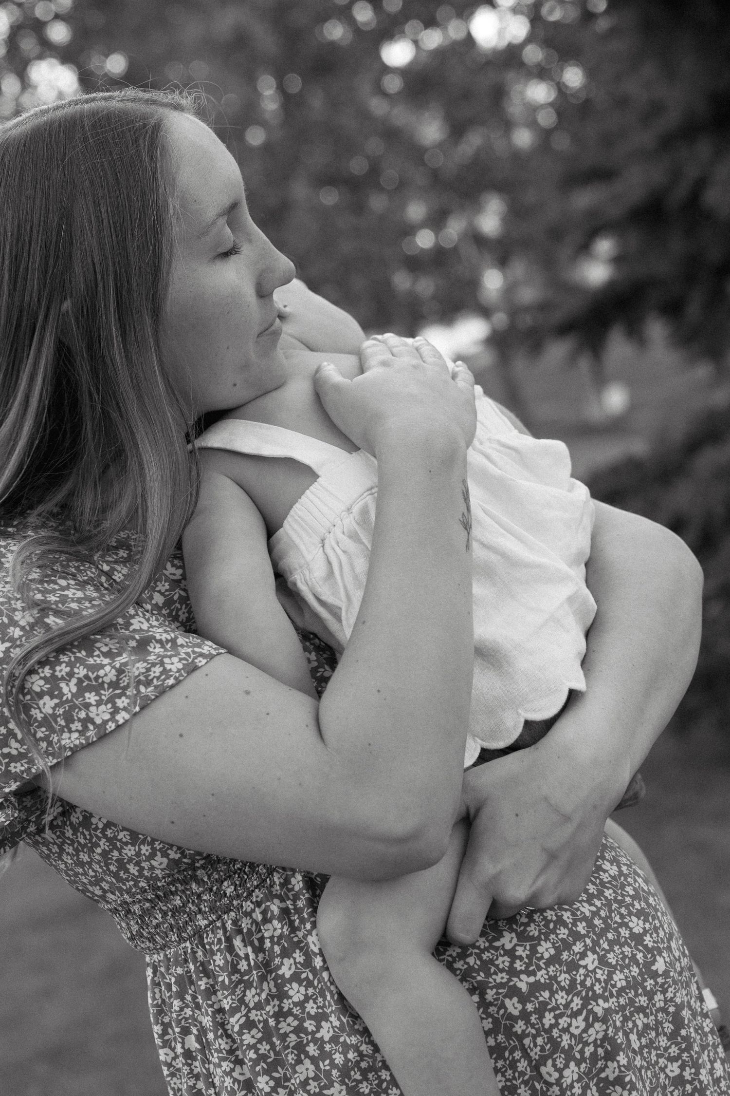 Motherhood portraits in Regina, Saskatchewan capturing authentic connection between mothers and their children.