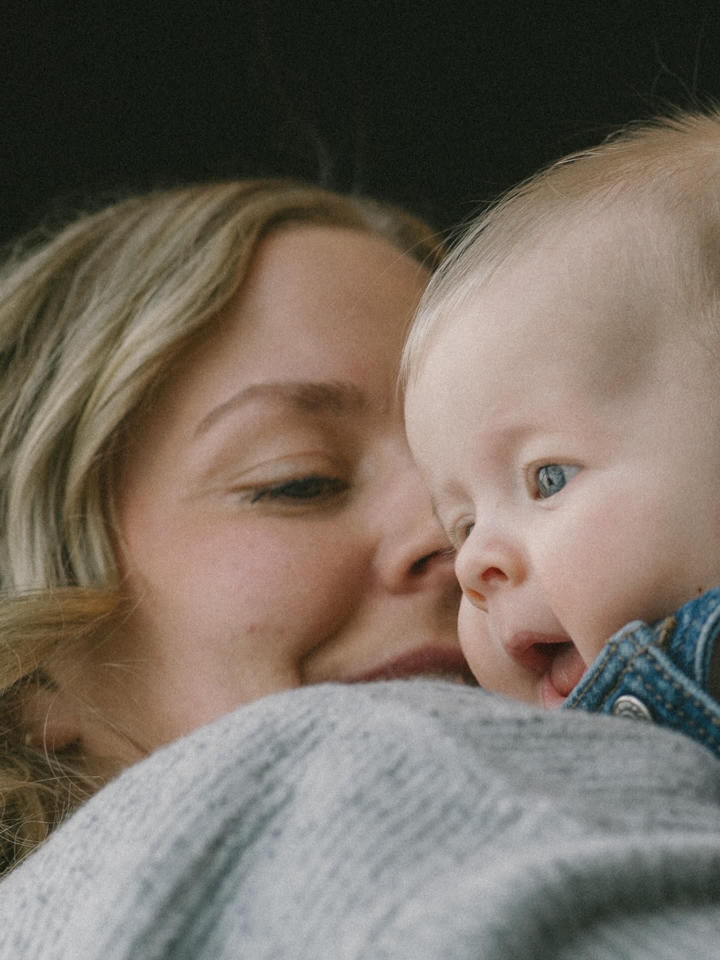 Signature motherhood portraits in Regina, Saskatchewan capturing authentic connection between mothers and their children.