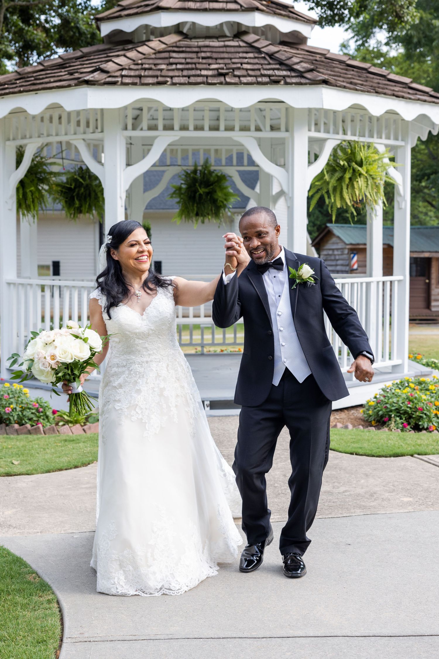 Playful wedding photo sequence of couple posing in front of white gazebo.