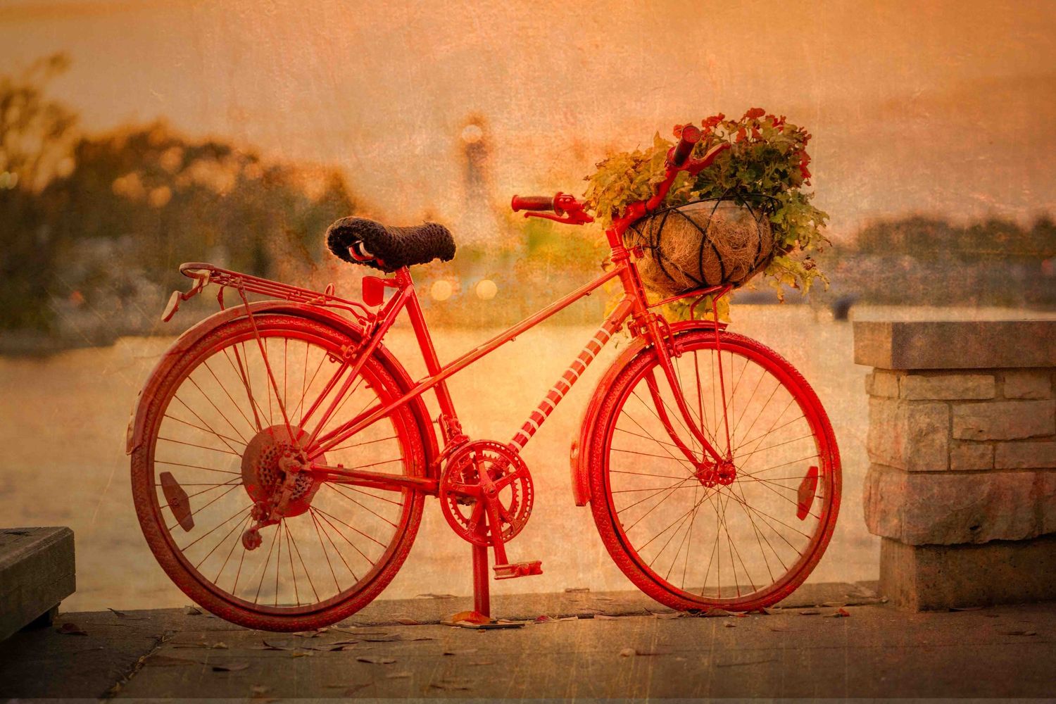 The Town of Port Credit's famous red bicyclel in warm sunset lighting creating a nostalgic, fine art scene.