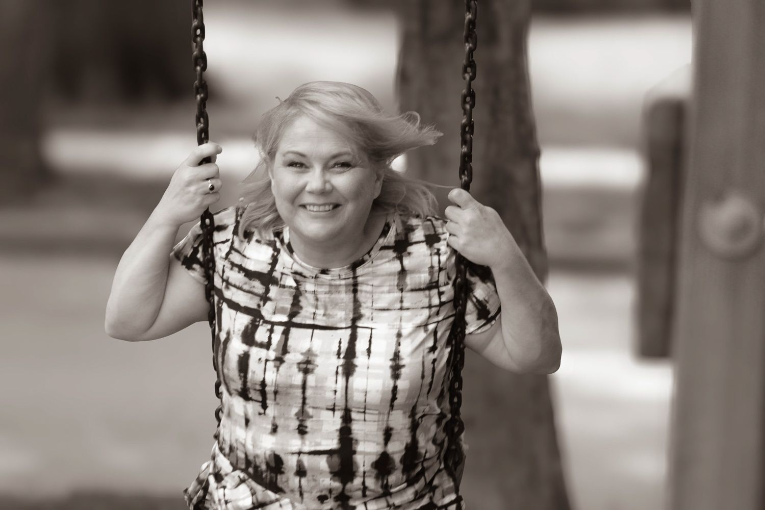 Anna, of Baltimore, on swings in the playground.