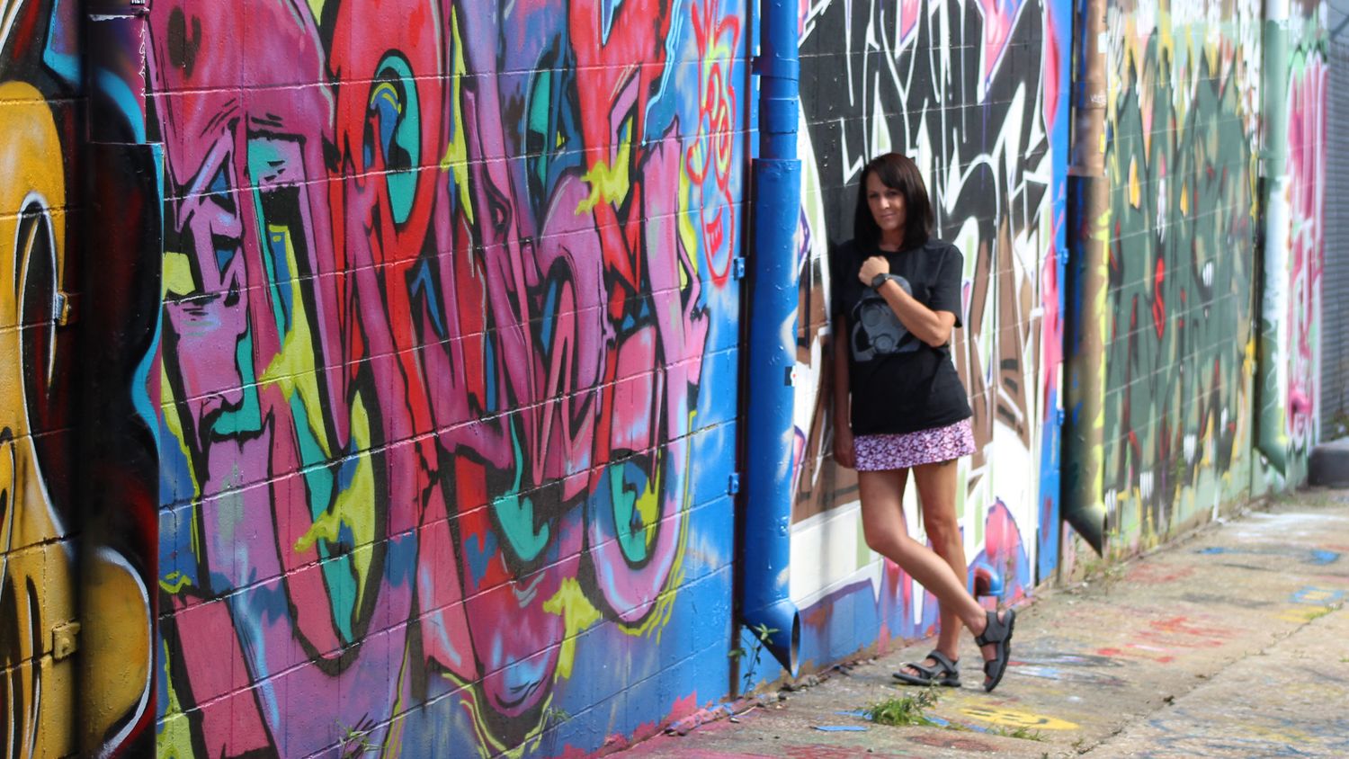 Audra Dietz, photojournalist at a Graffiti Wall in the Crossroads District of Kansas City, Missouri.