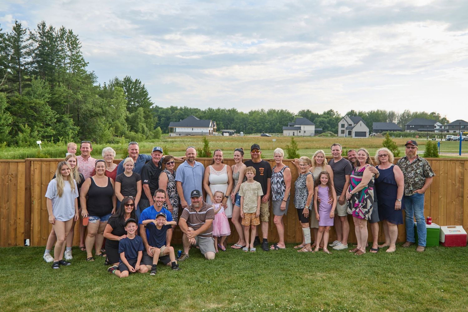 Extended family photo outdoors.