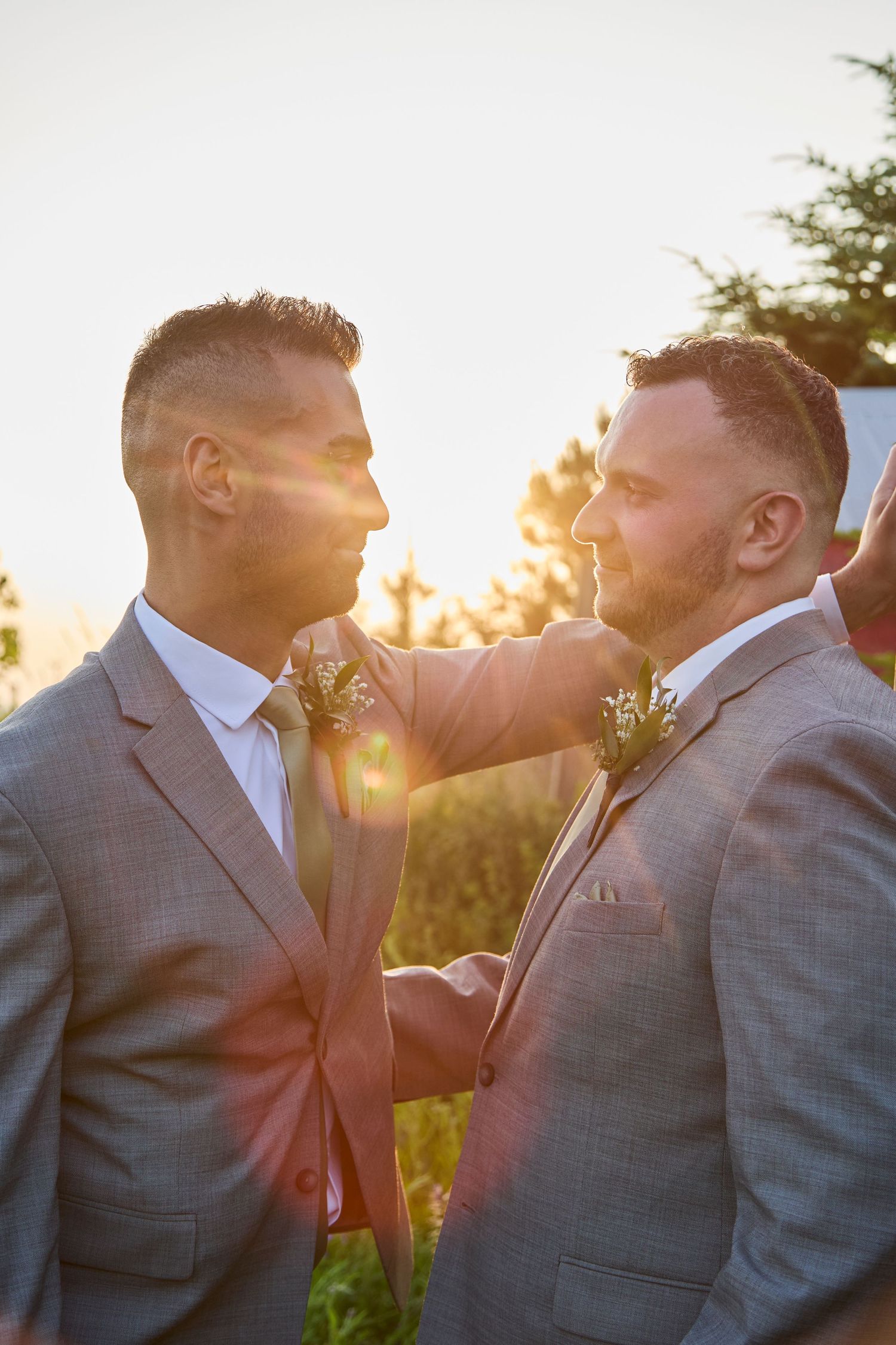 Two grooms in a sunset location.