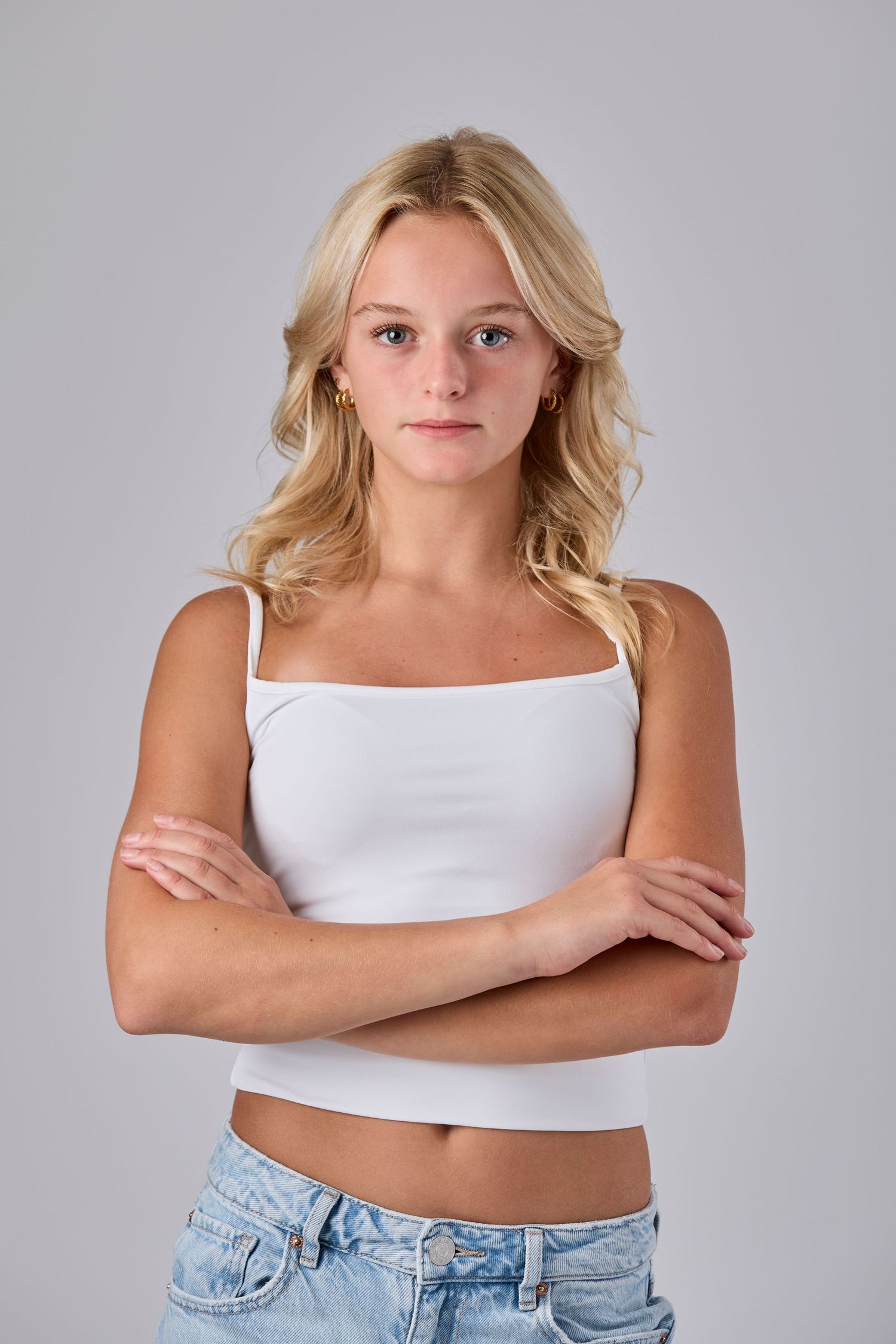 Model headshot on grey background.