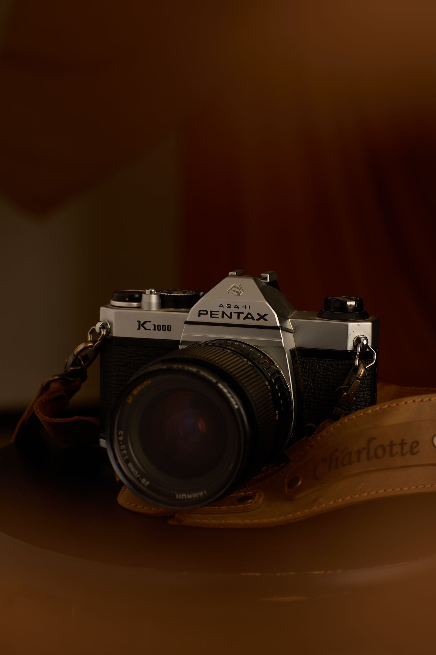 Vintage film camera with custom leather strap.