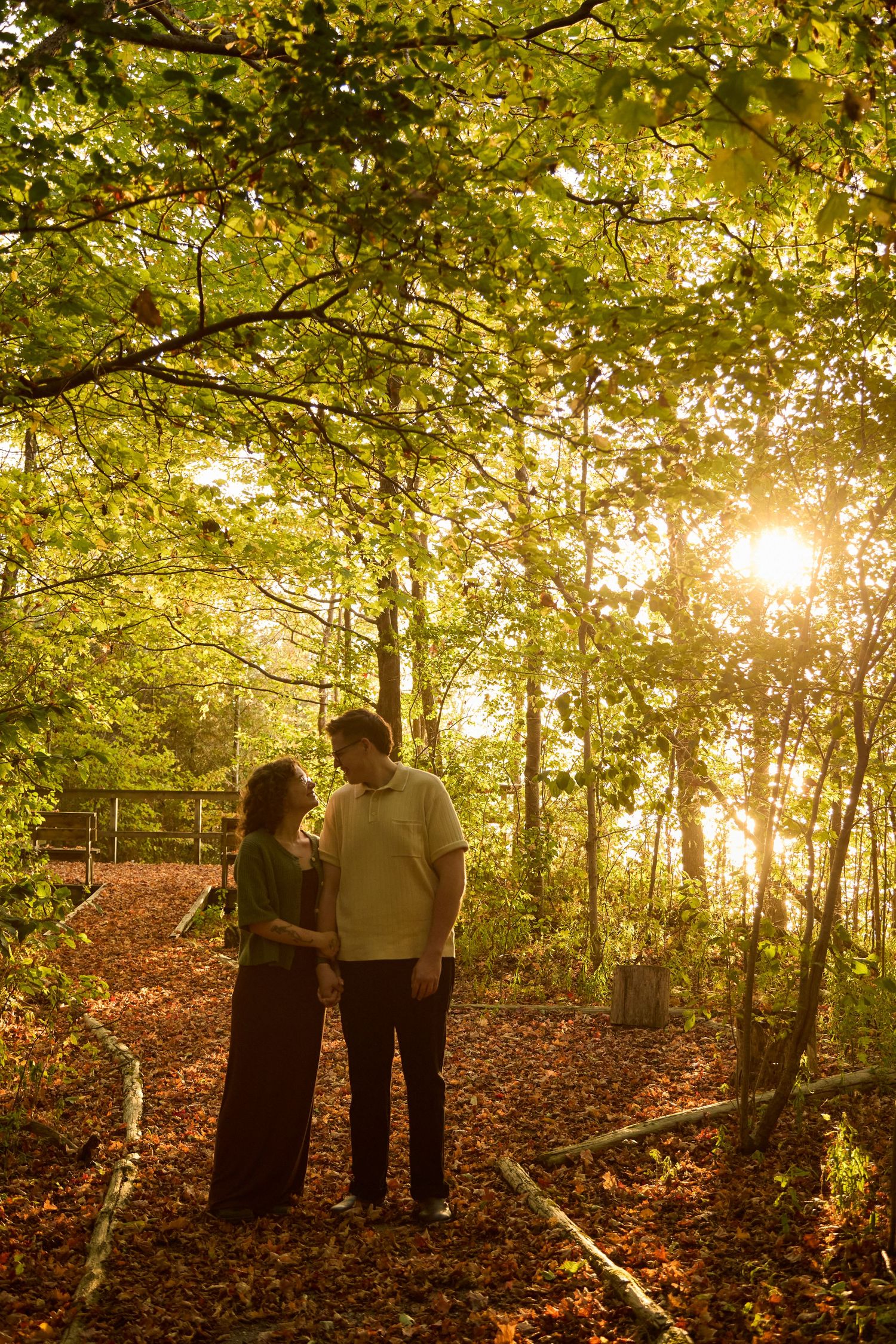 Couple in forrest at golden hour.