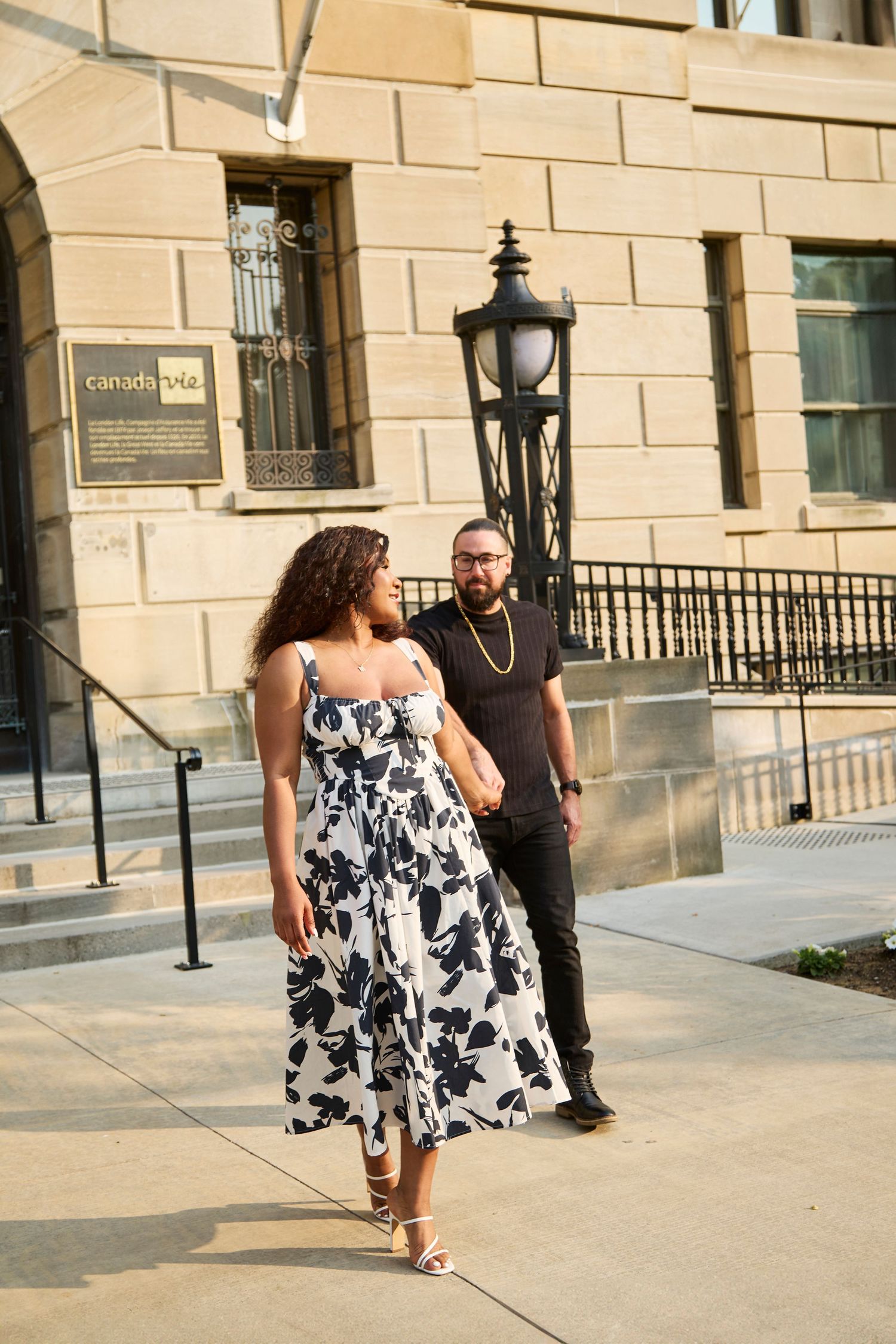 Engaged couple walking.