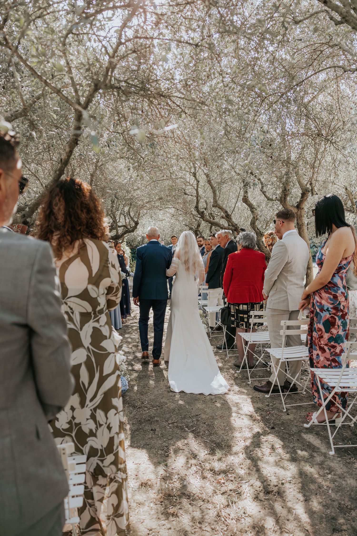 bride walking down the aisle at Le Petit Roulet wedding venue