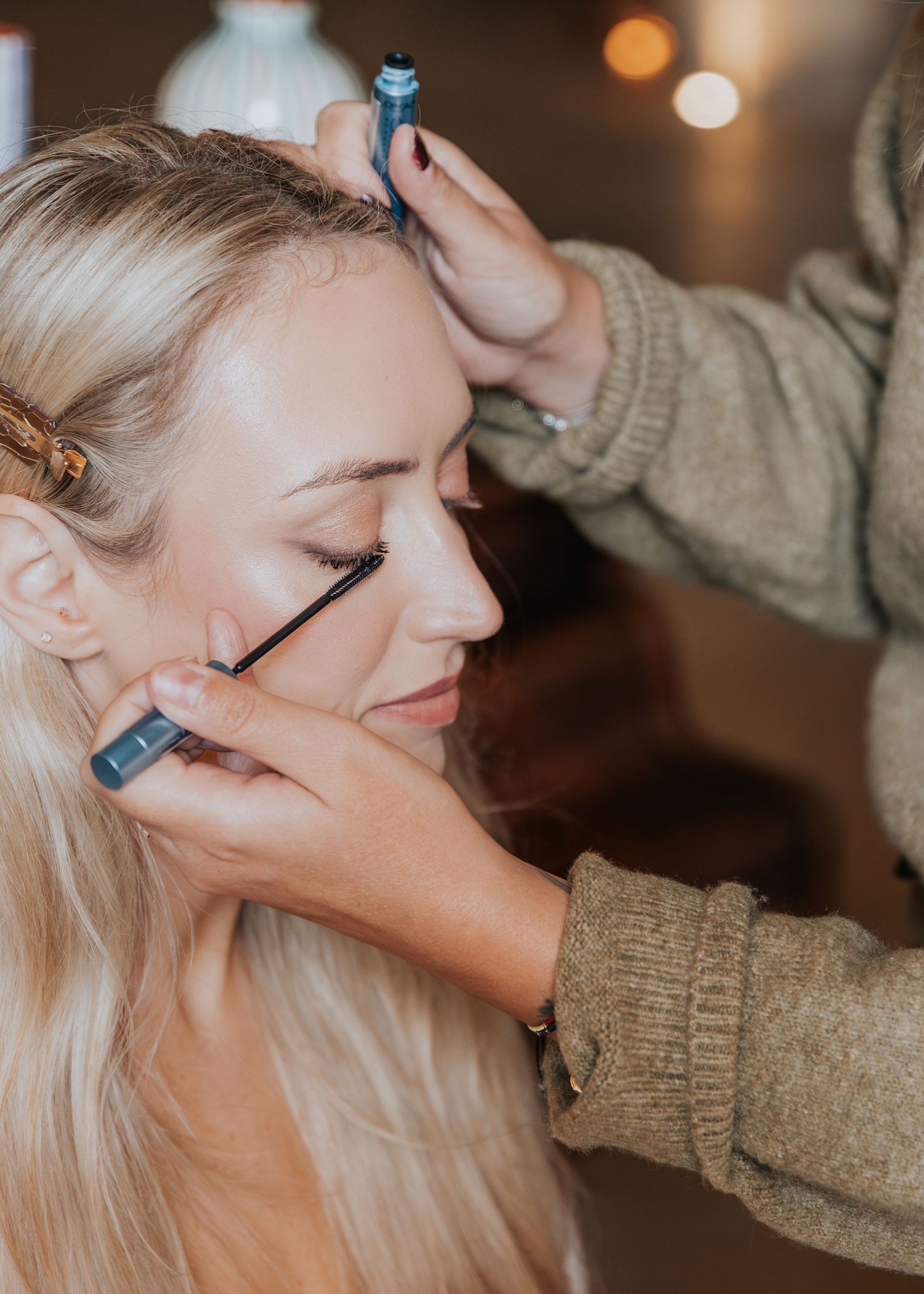 make up moment at Le Petit Roulet wedding in France captured in an editorial documentary style