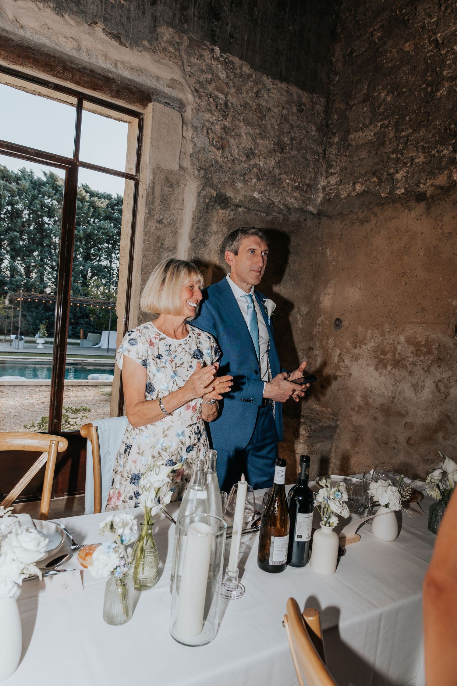guests cheering at destination wedding in france