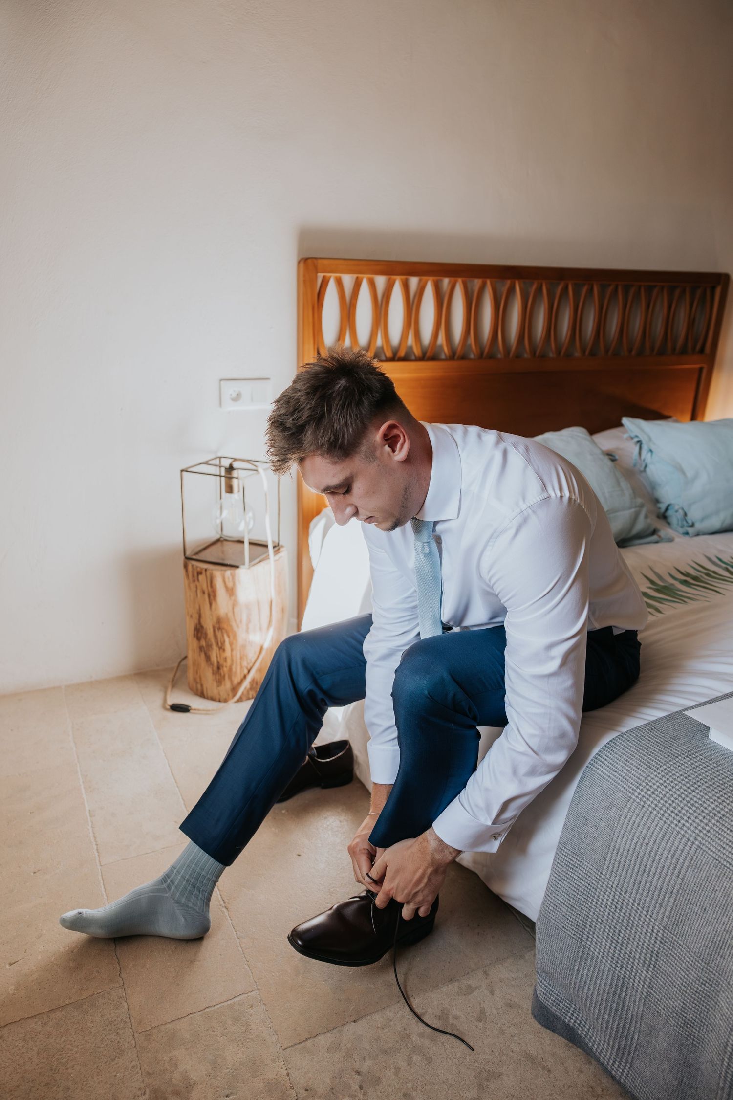 groom prep at Le Petit Roulet wedding in France captured in an editorial documentary style