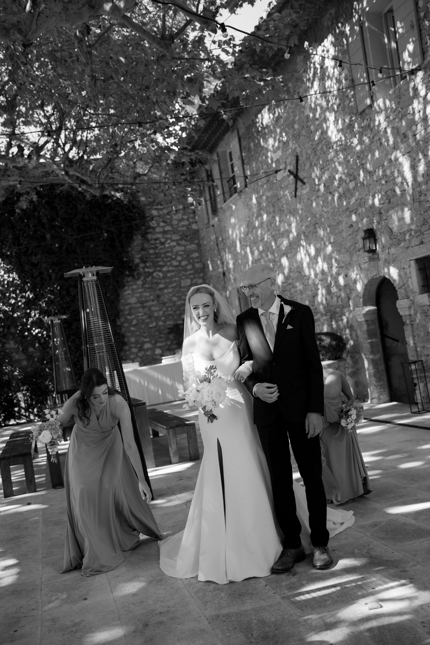 bride walking down at Le Petit Roulet wedding in France captured in an editorial documentary style