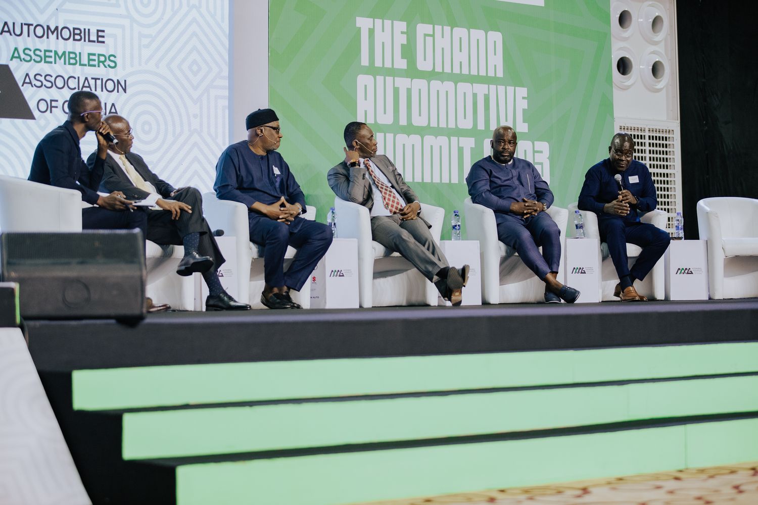 Five panelists discussing automotive industry at The Ghana Automotive Summit 2023.