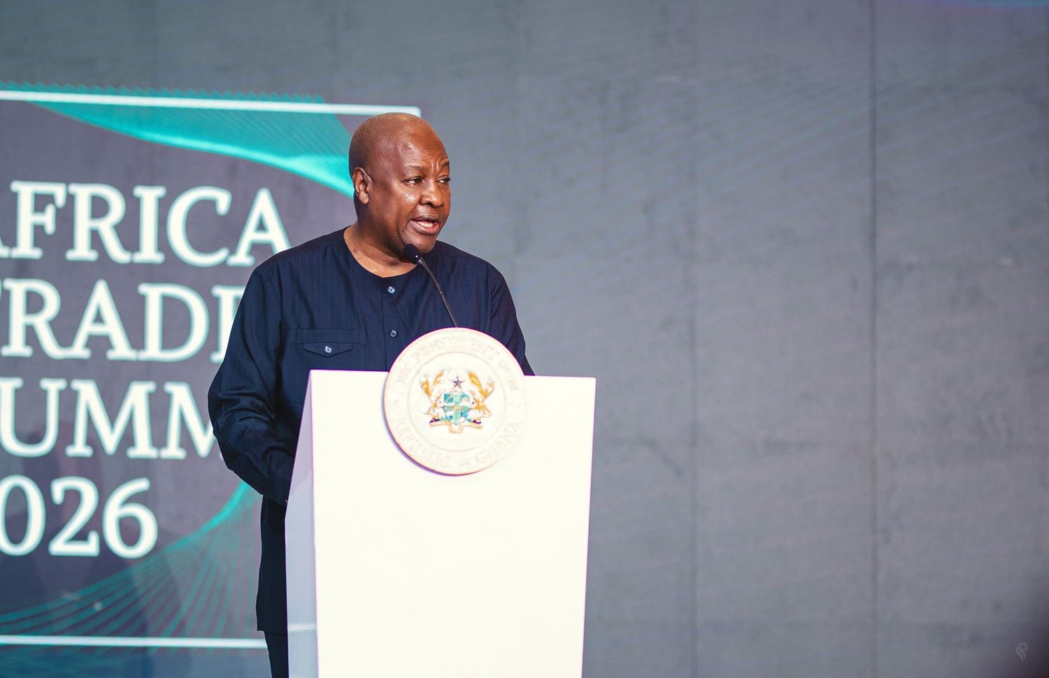 A distinguished speaker addresses an audience at the Africa Trading Summit 2026 podium.