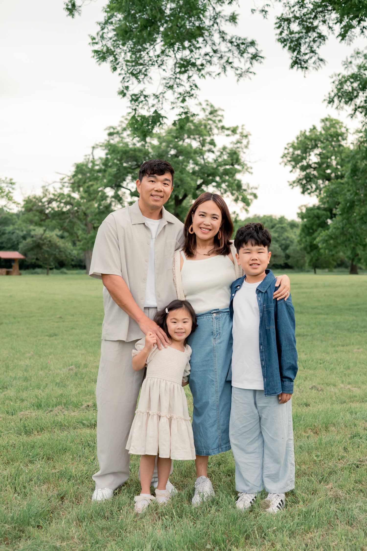 Portrait of a family smiling together during a sunset session