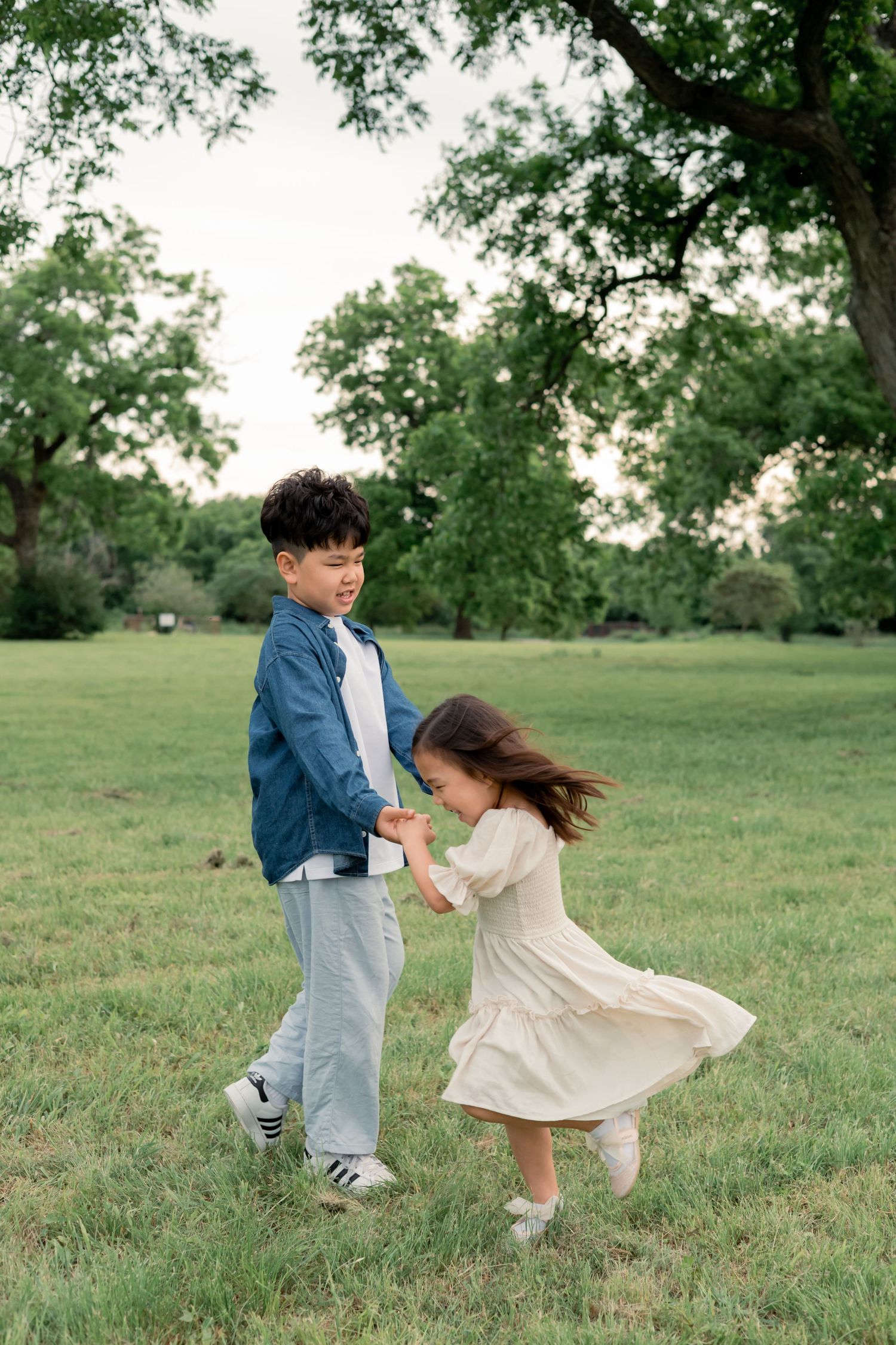 Siblings playing together during an outdoor family session
