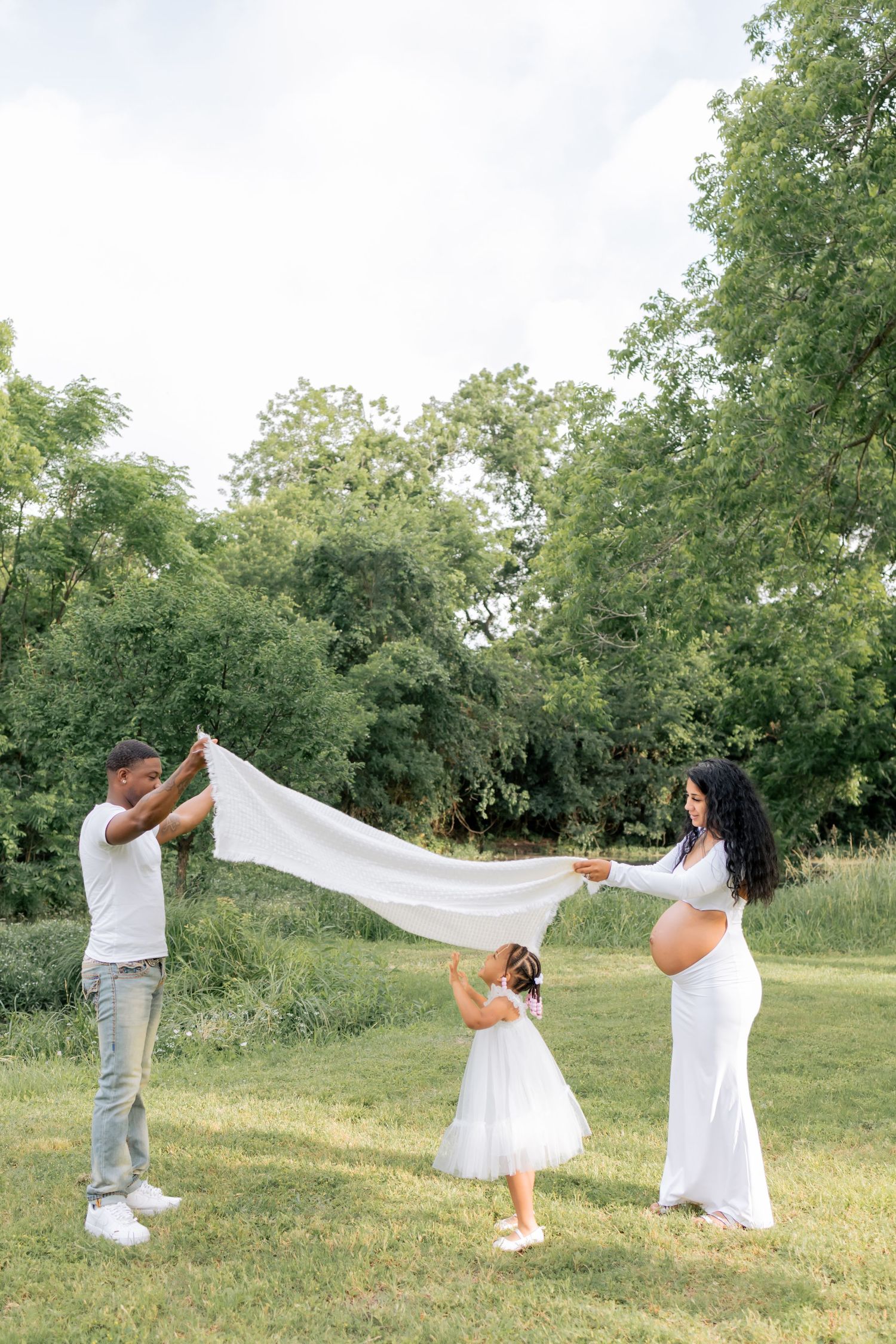 Family playing with daughter during a morning lifestyle family session