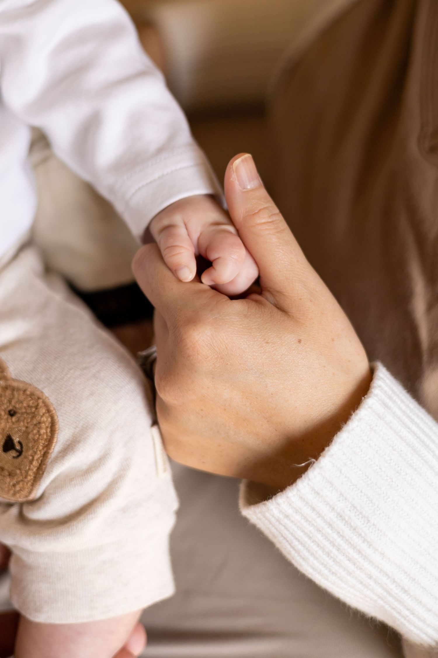Closeup of newborn baby hands during a lifestyle newborn session