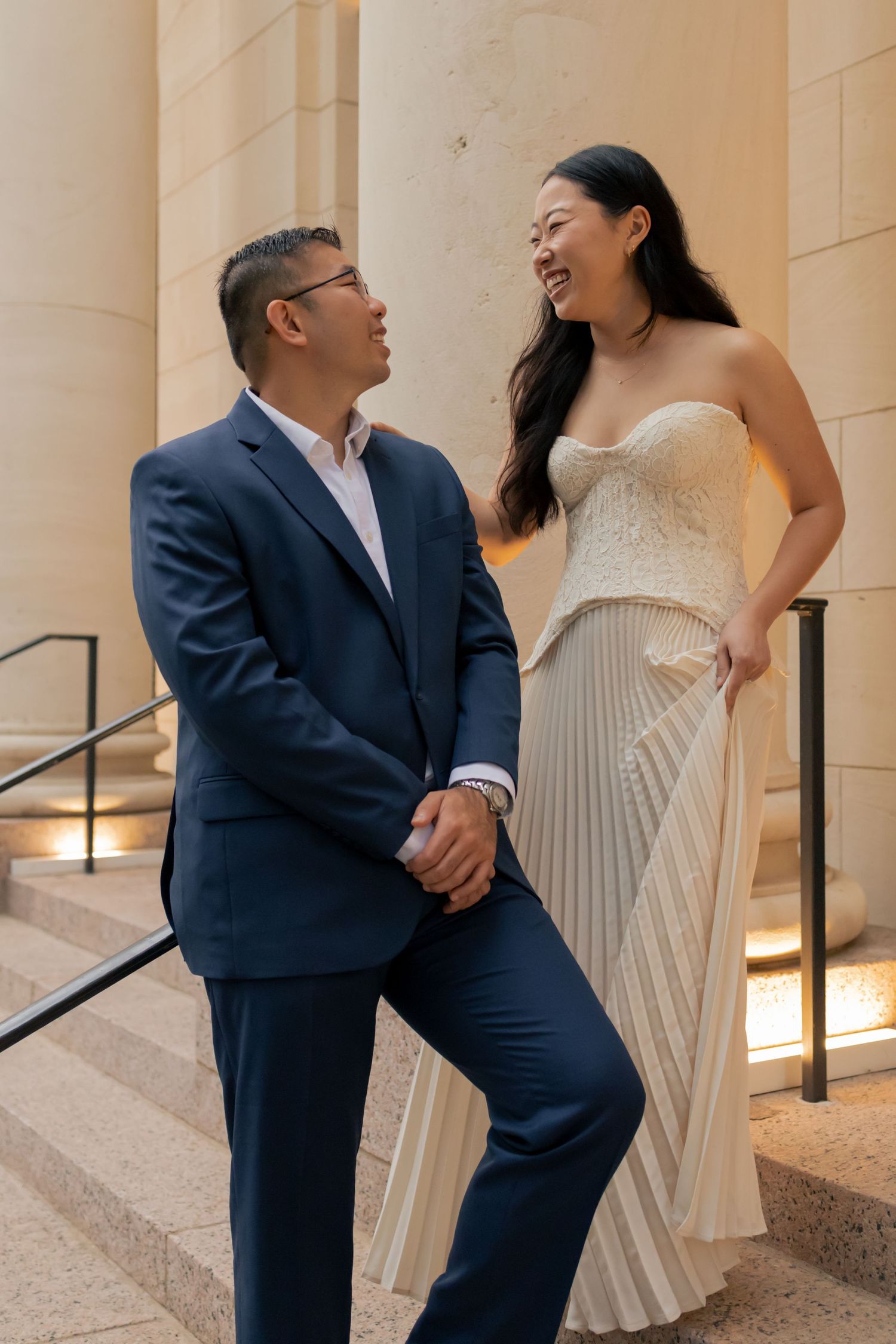 Couple embracing one another in downtown Austin during a sunrise engagement session
