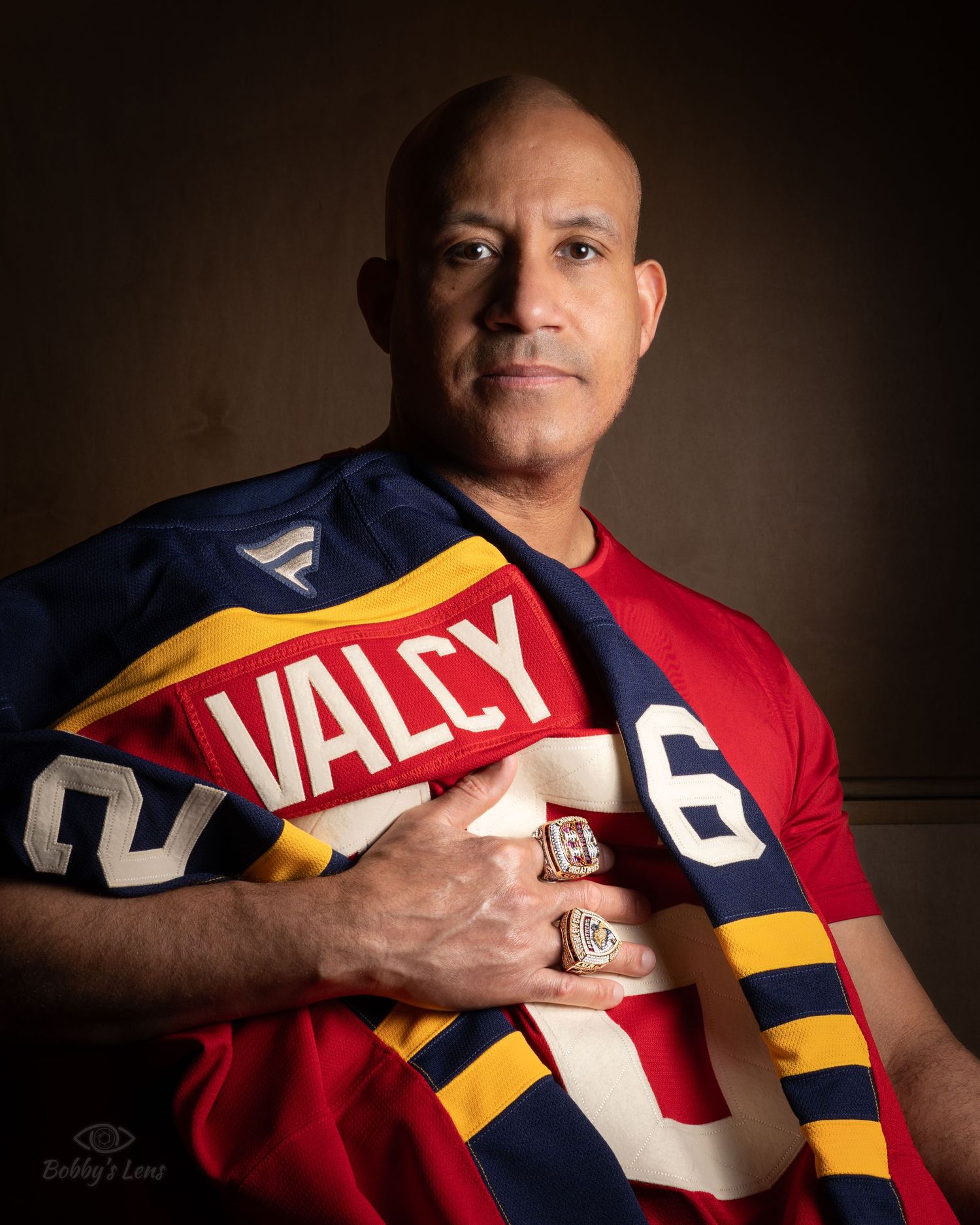 Hockey championship portrait with rings and jersey in Sunrise Florida