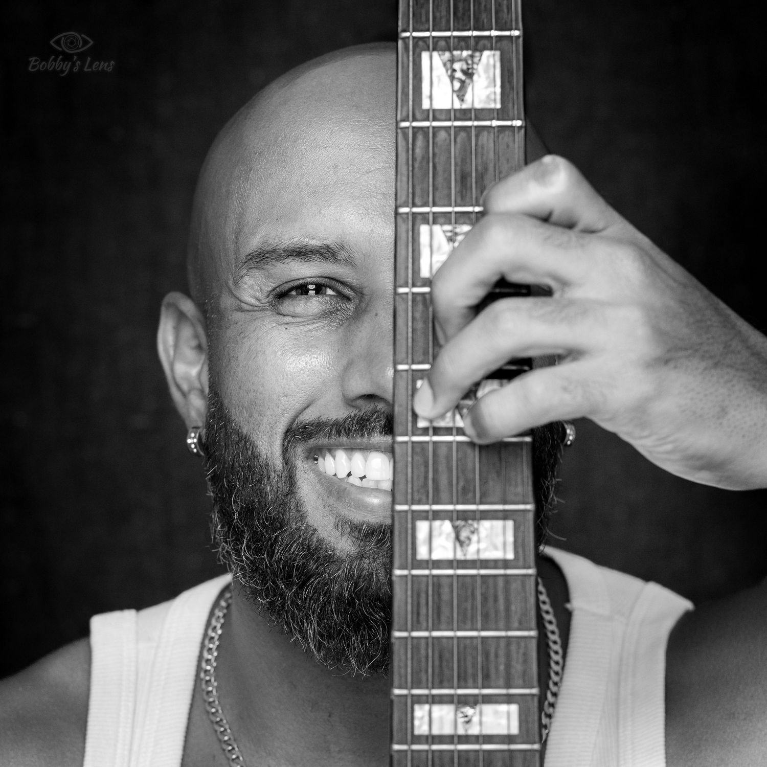 Black and white artist headshot with guitar in Pompano Beach South Florida