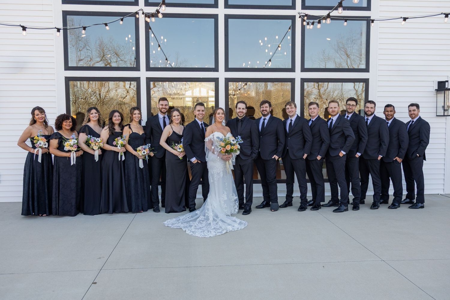 The wedding party.  Bride, groom, groomsman, bridesmaids, at an elegant luxury venue.