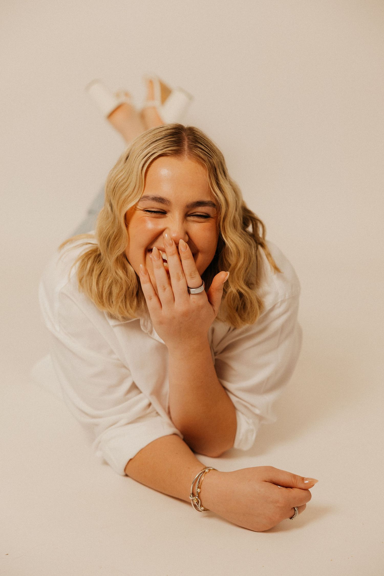 A soft studio portrait capturing a calm, confident moment.