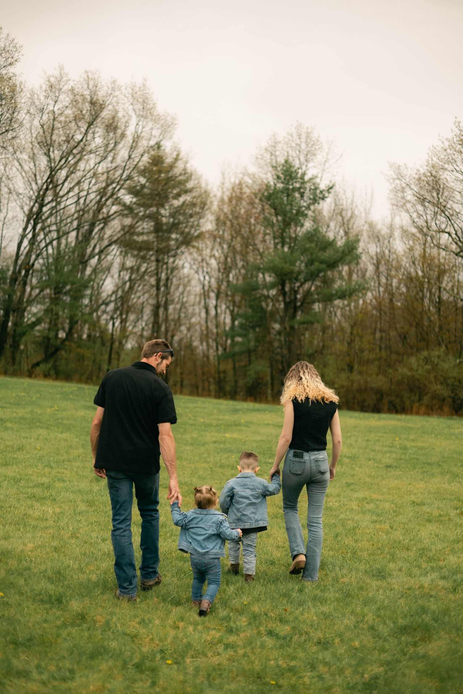 A quiet moment of a family holding each other, full of warmth and connection.