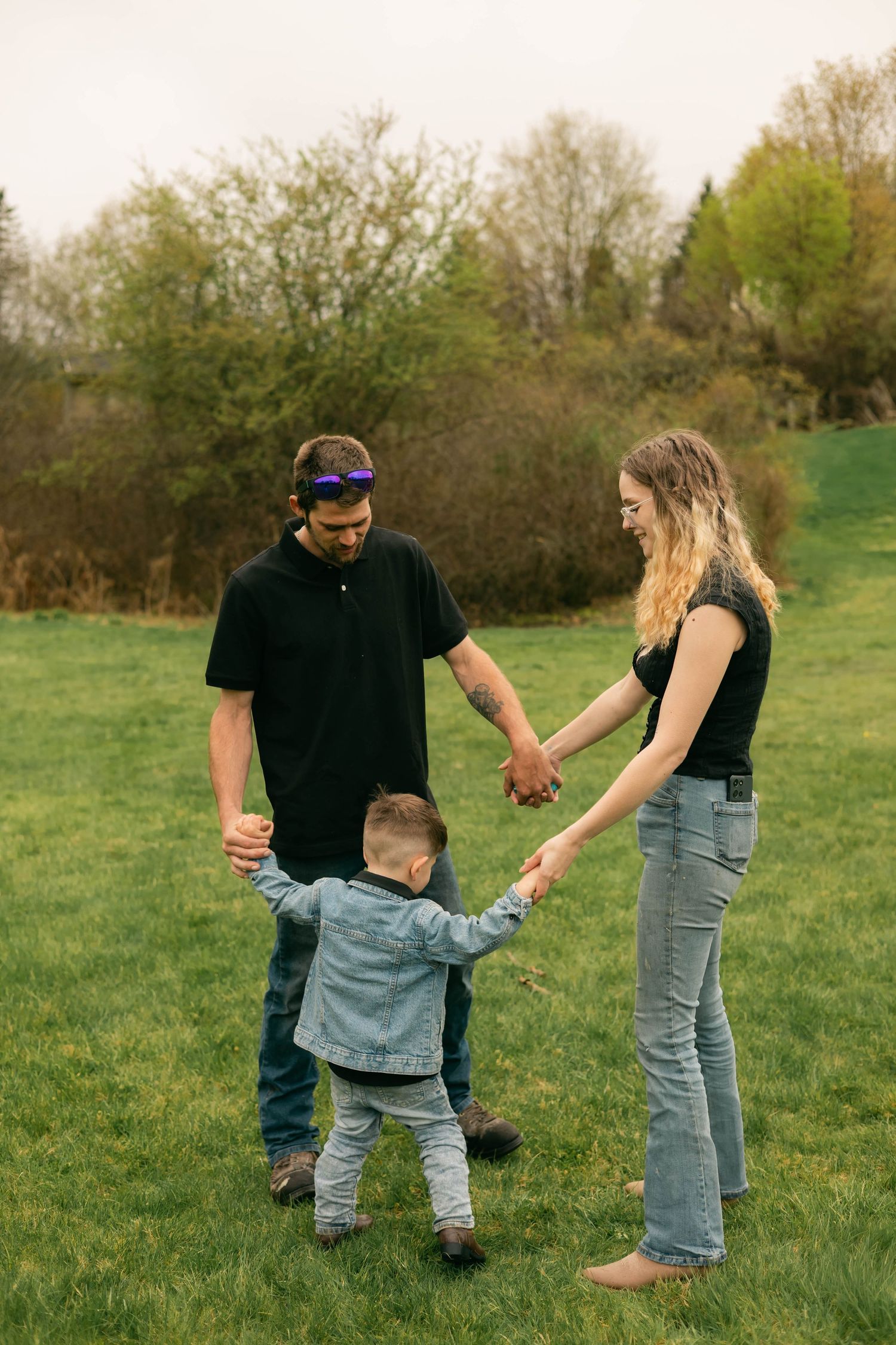 A quiet moment of a family holding each other, full of warmth and connection.