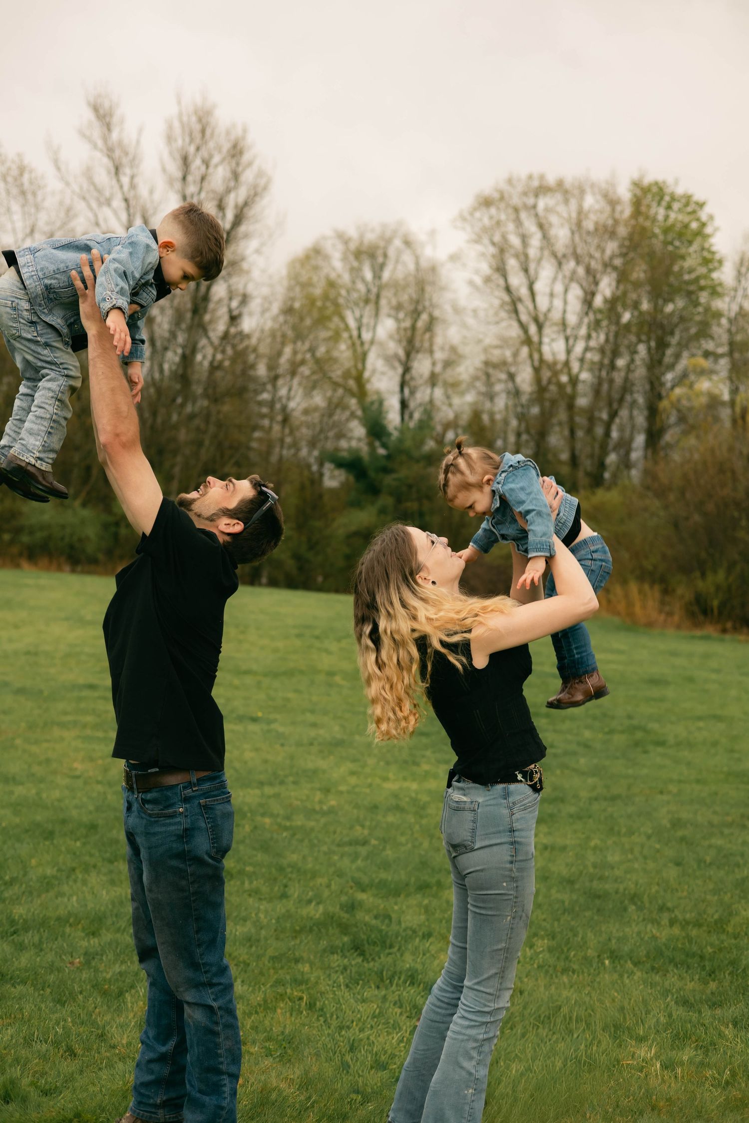 A quiet moment of a family holding each other, full of warmth and connection.