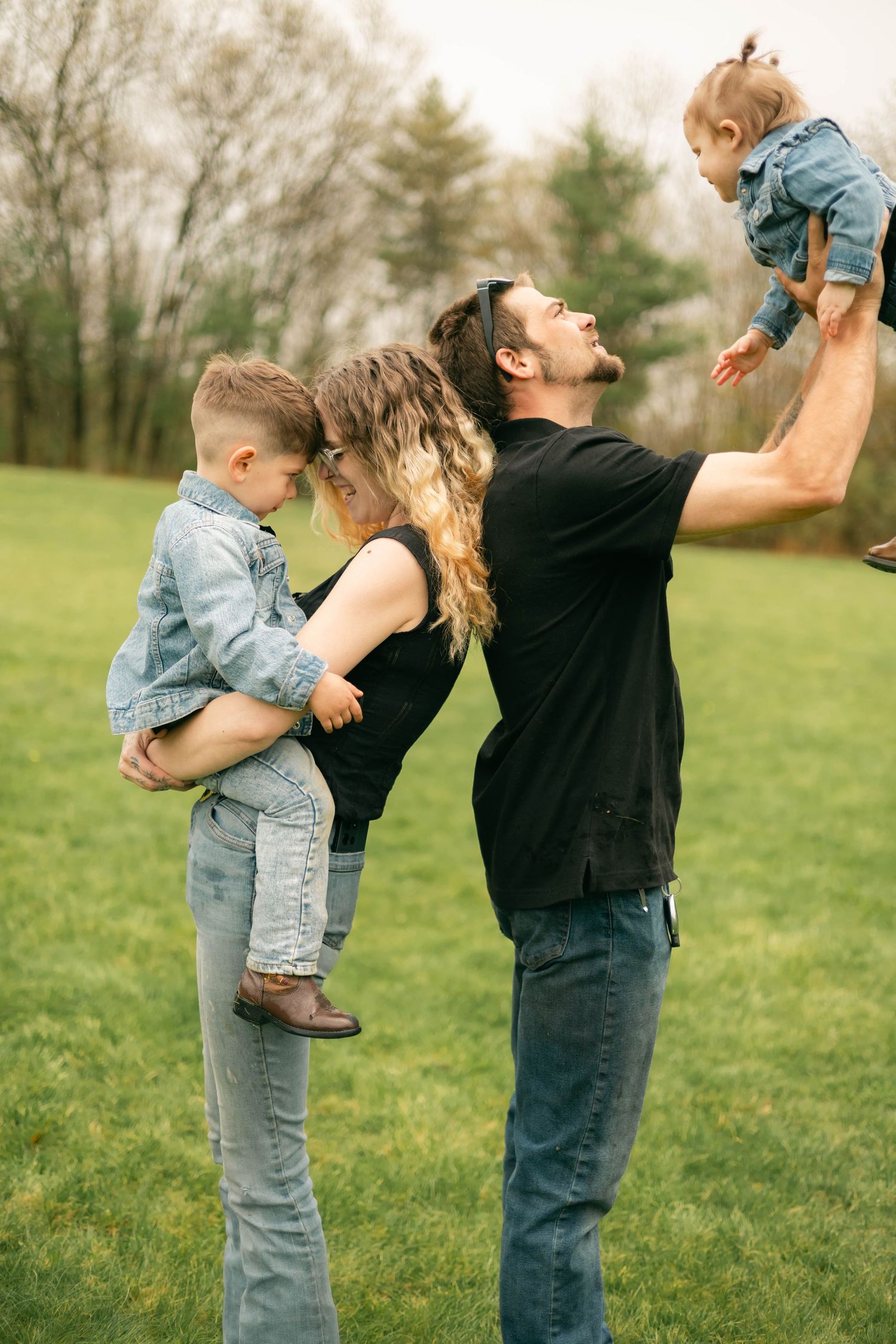 A quiet moment of a family holding each other, full of warmth and connection.