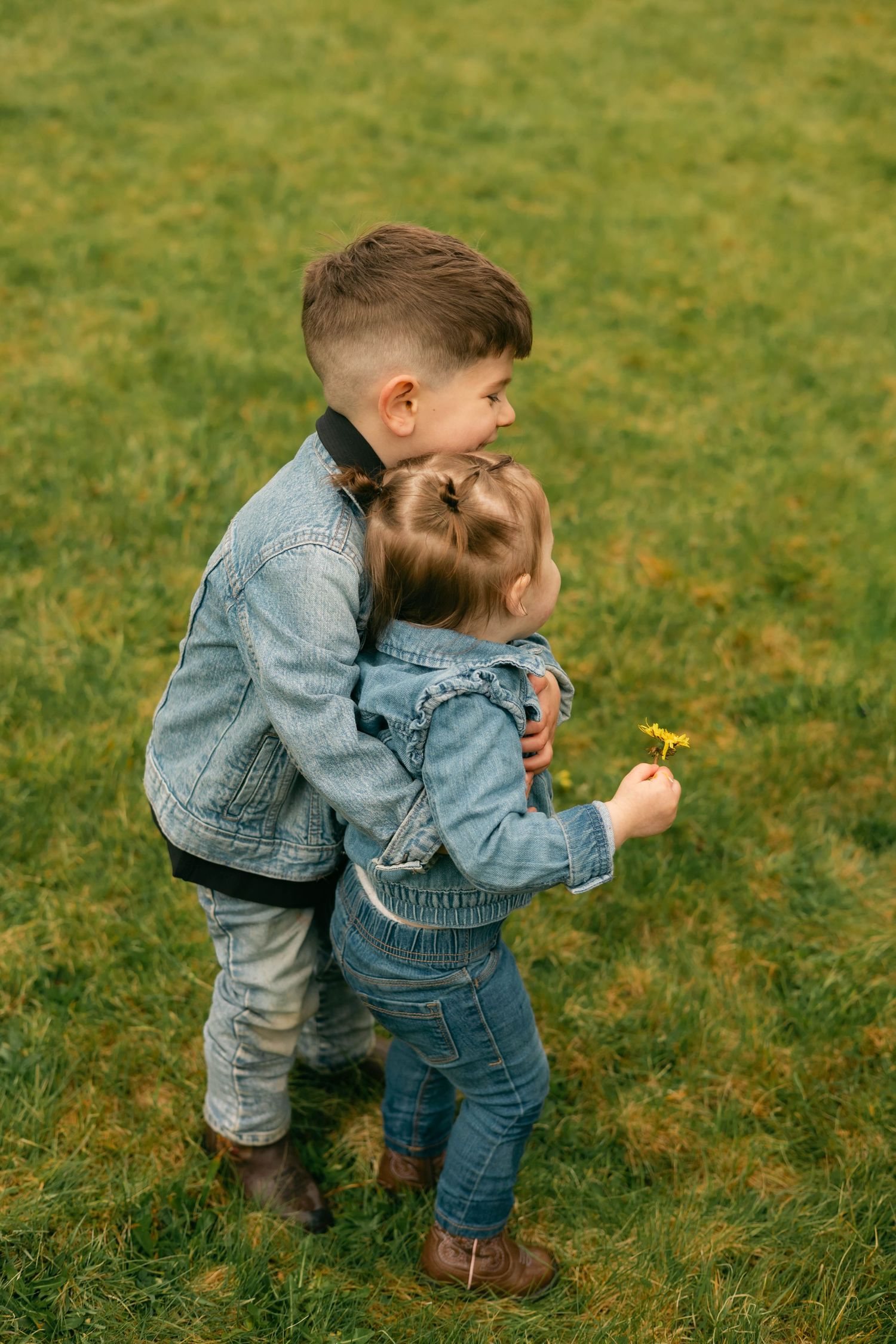 A quiet moment of a family holding each other, full of warmth and connection.