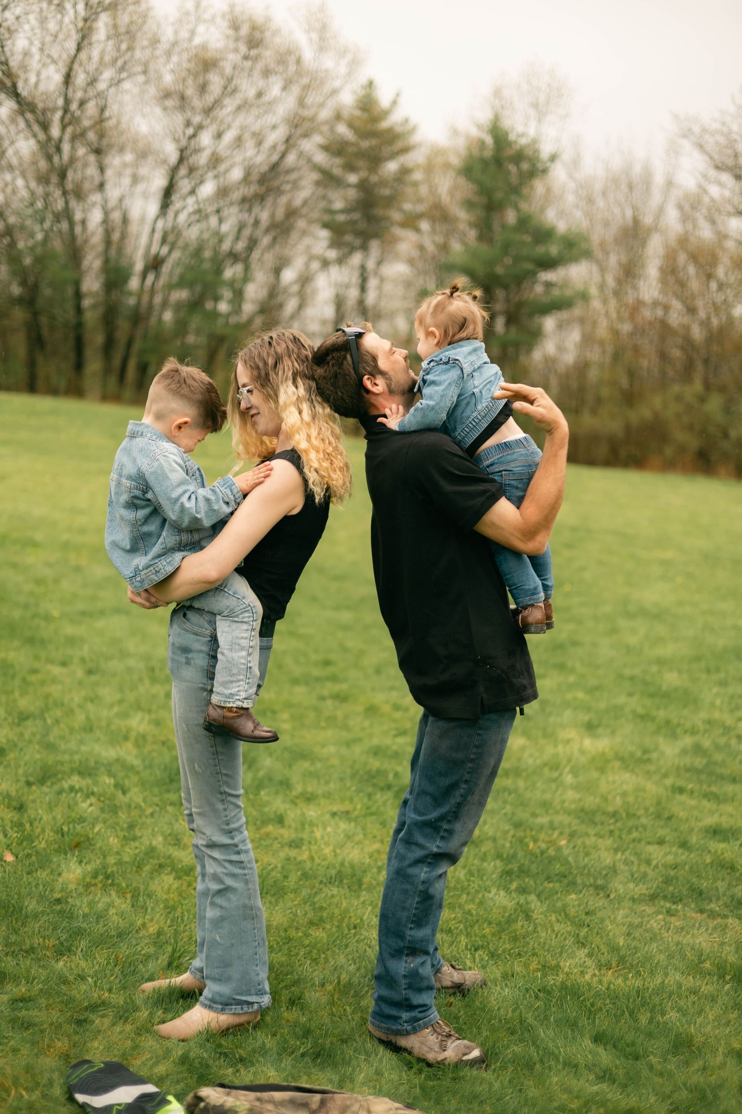 A quiet moment of a family holding each other, full of warmth and connection.