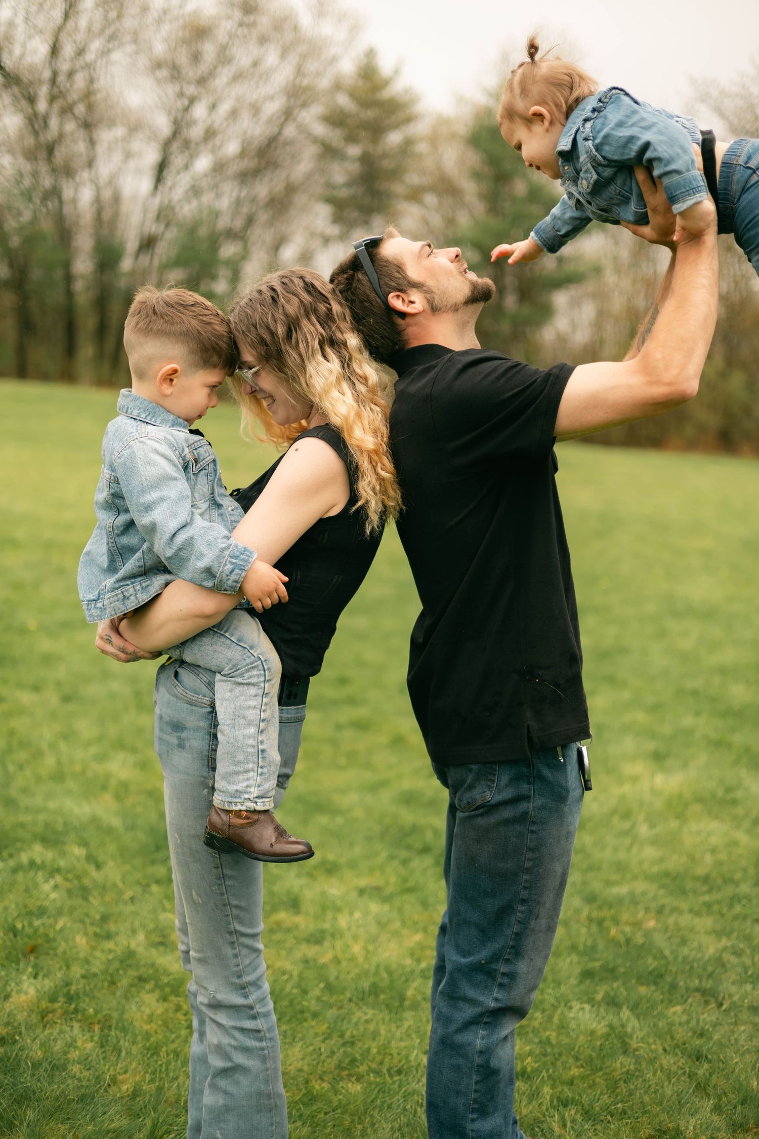 A quiet moment of a family holding each other, full of warmth and connection.