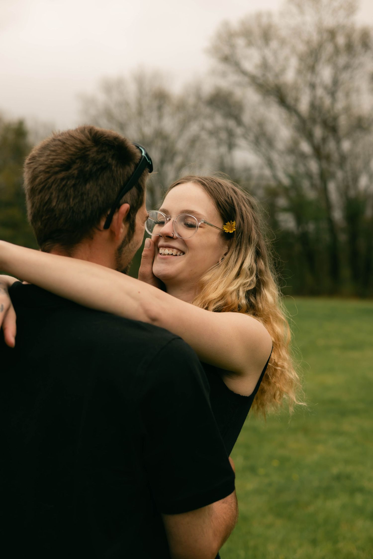 A quiet moment of a family holding each other, full of warmth and connection.