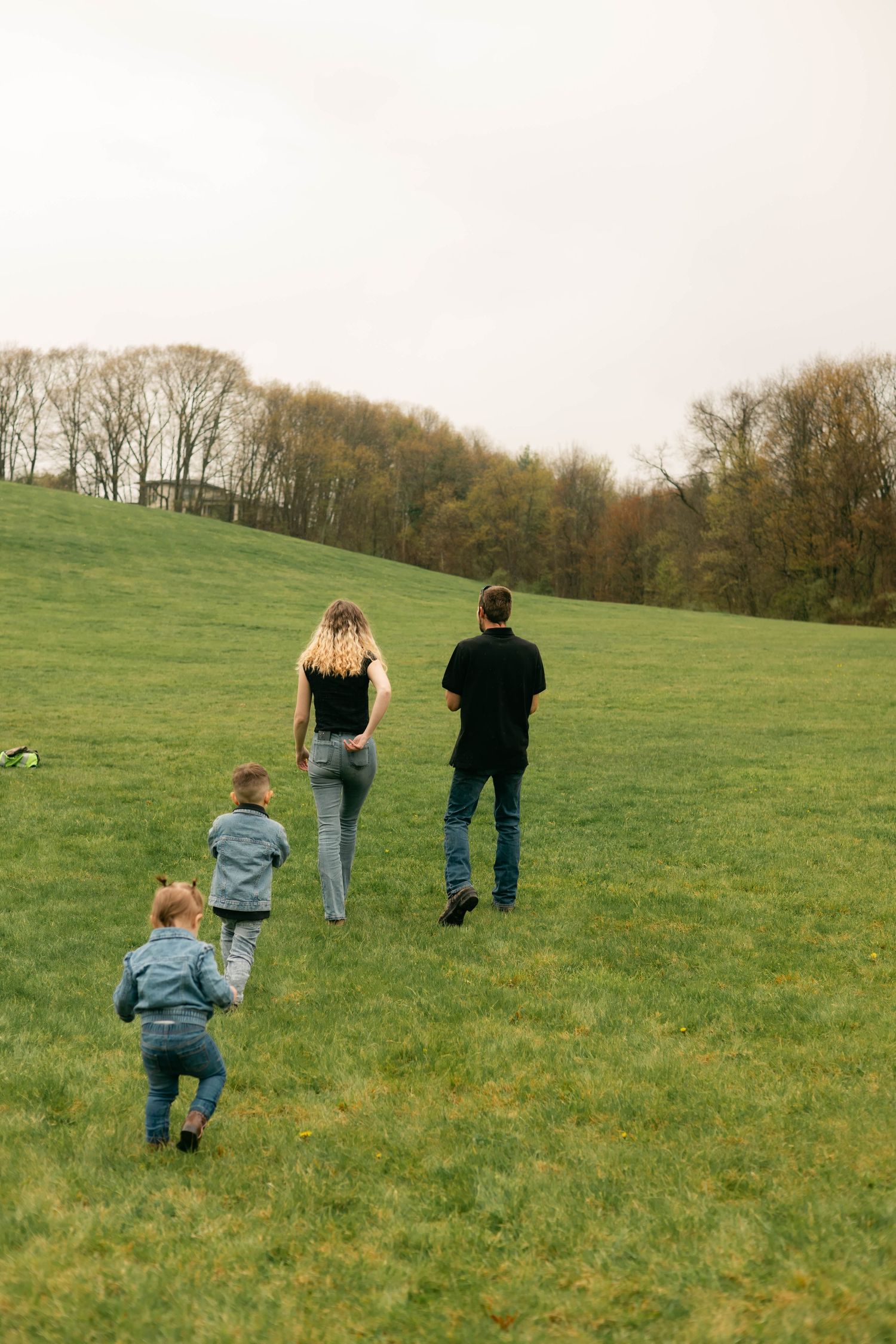 A quiet moment of a family holding each other, full of warmth and connection.
