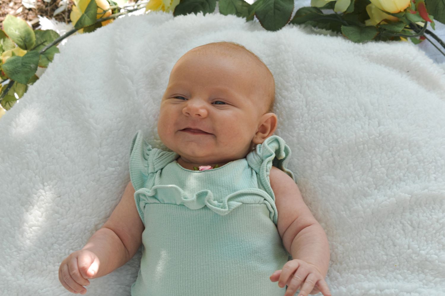 baby smiling for photoshoot